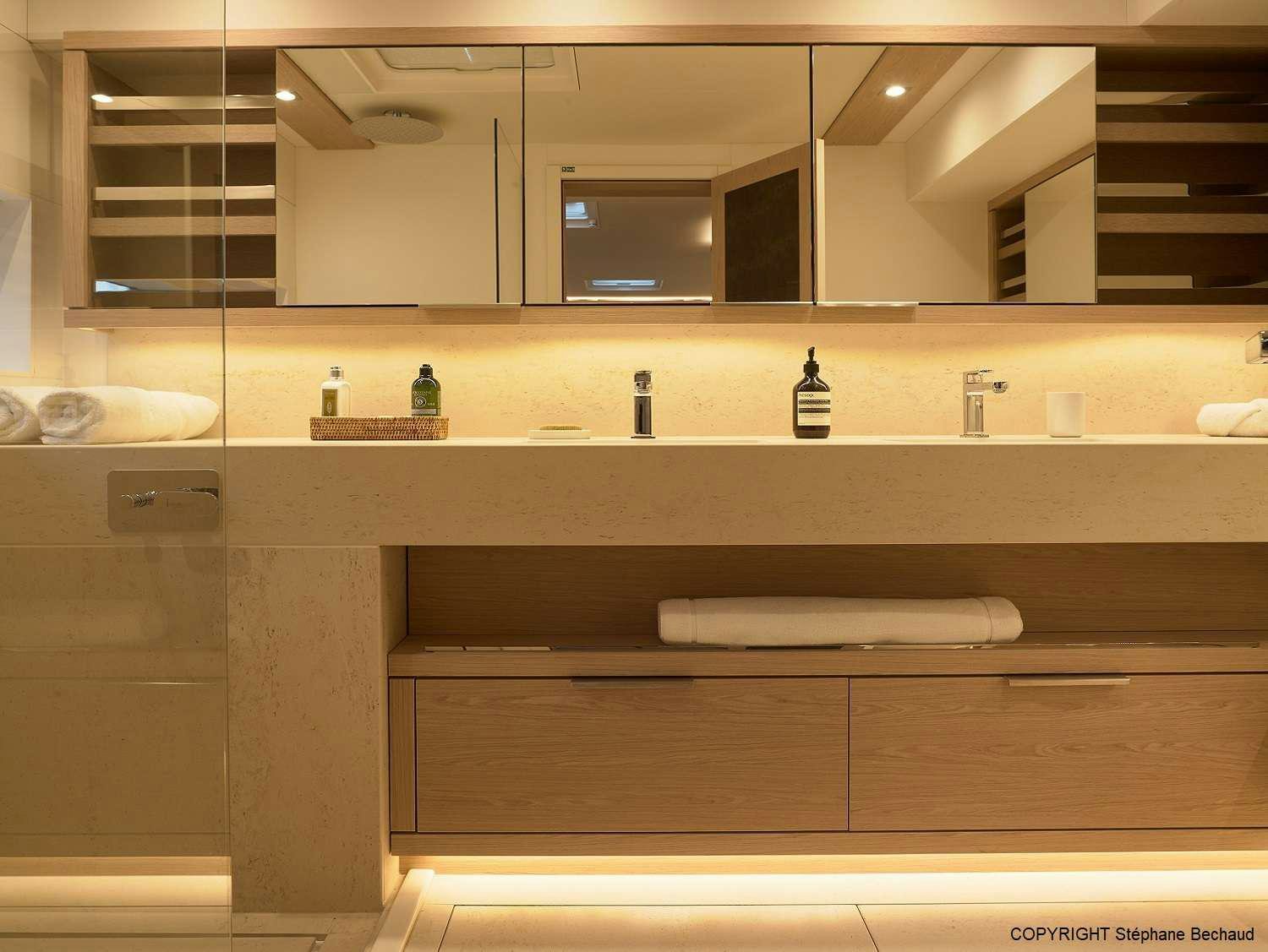 a bathroom with a large mirror aboard KAJIKIA Yacht for Charter