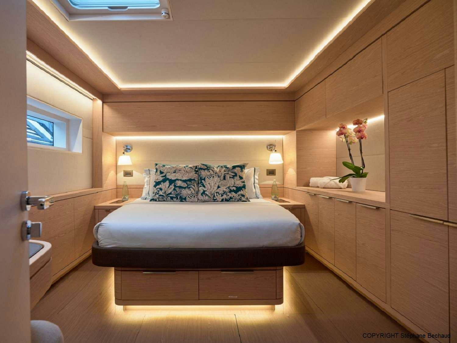 a bed in a room aboard KAJIKIA Yacht for Charter