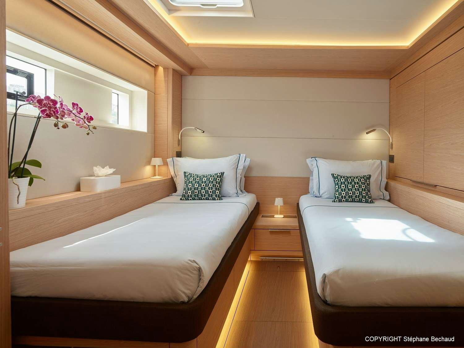 a room with two beds aboard KAJIKIA Yacht for Charter