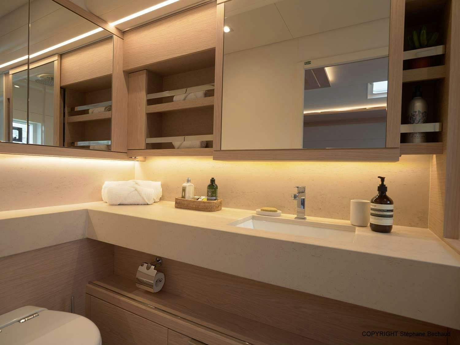 a bathroom with a glass wall aboard KAJIKIA Yacht for Charter