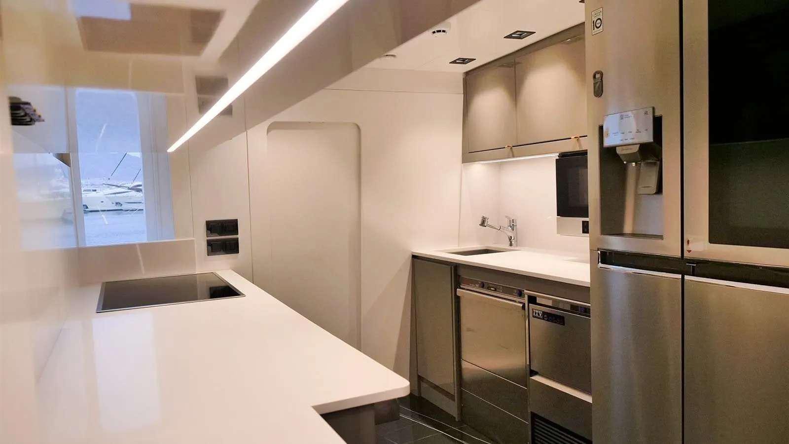 a kitchen with stainless steel appliances aboard MILGAUSS Yacht for Charter