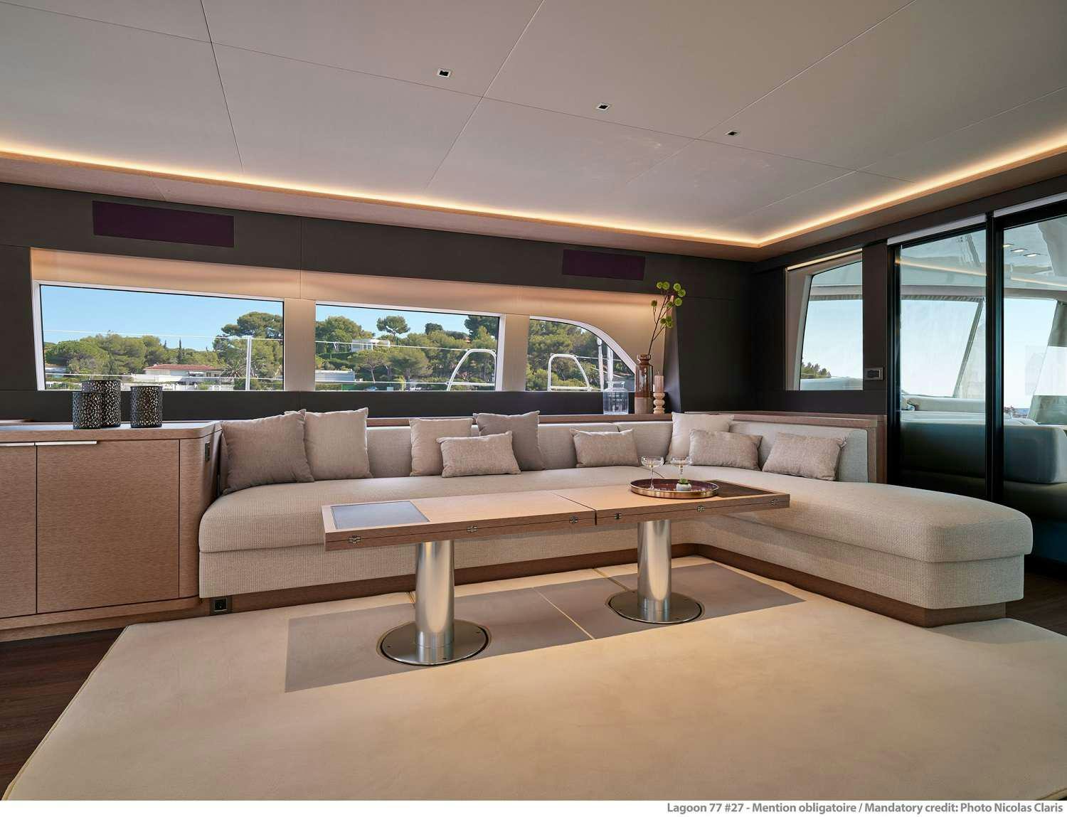 a living room with a large window aboard SYLENE Yacht for Charter