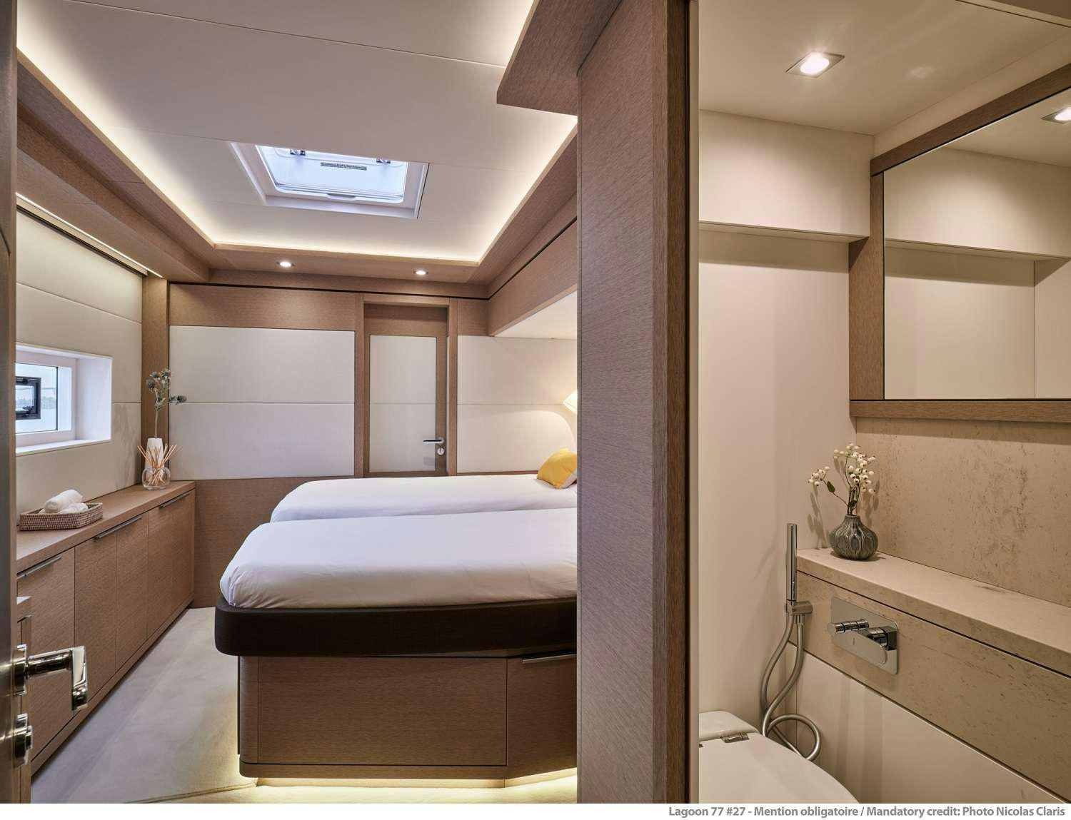 a bedroom with a bed and a desk aboard SYLENE Yacht for Charter
