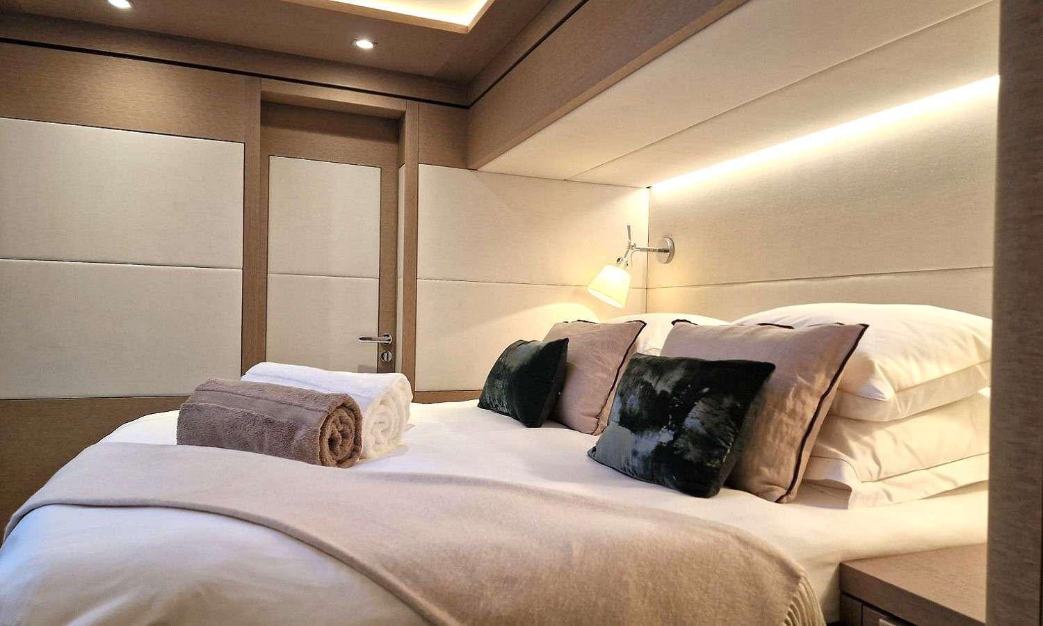 a bed with pillows aboard SYLENE Yacht for Charter