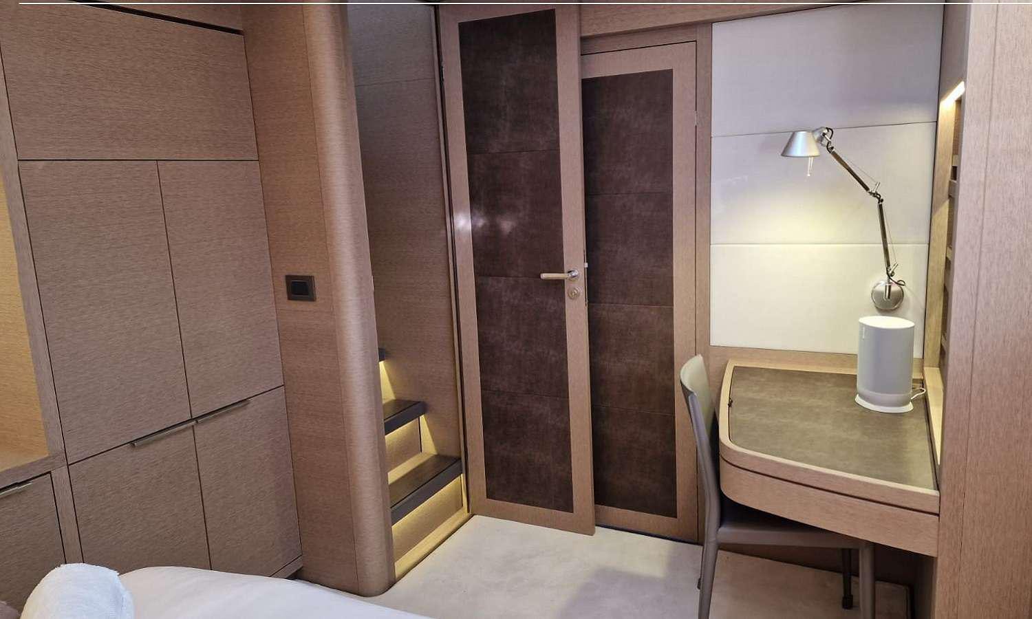 a room with a table and a chair aboard SYLENE Yacht for Charter