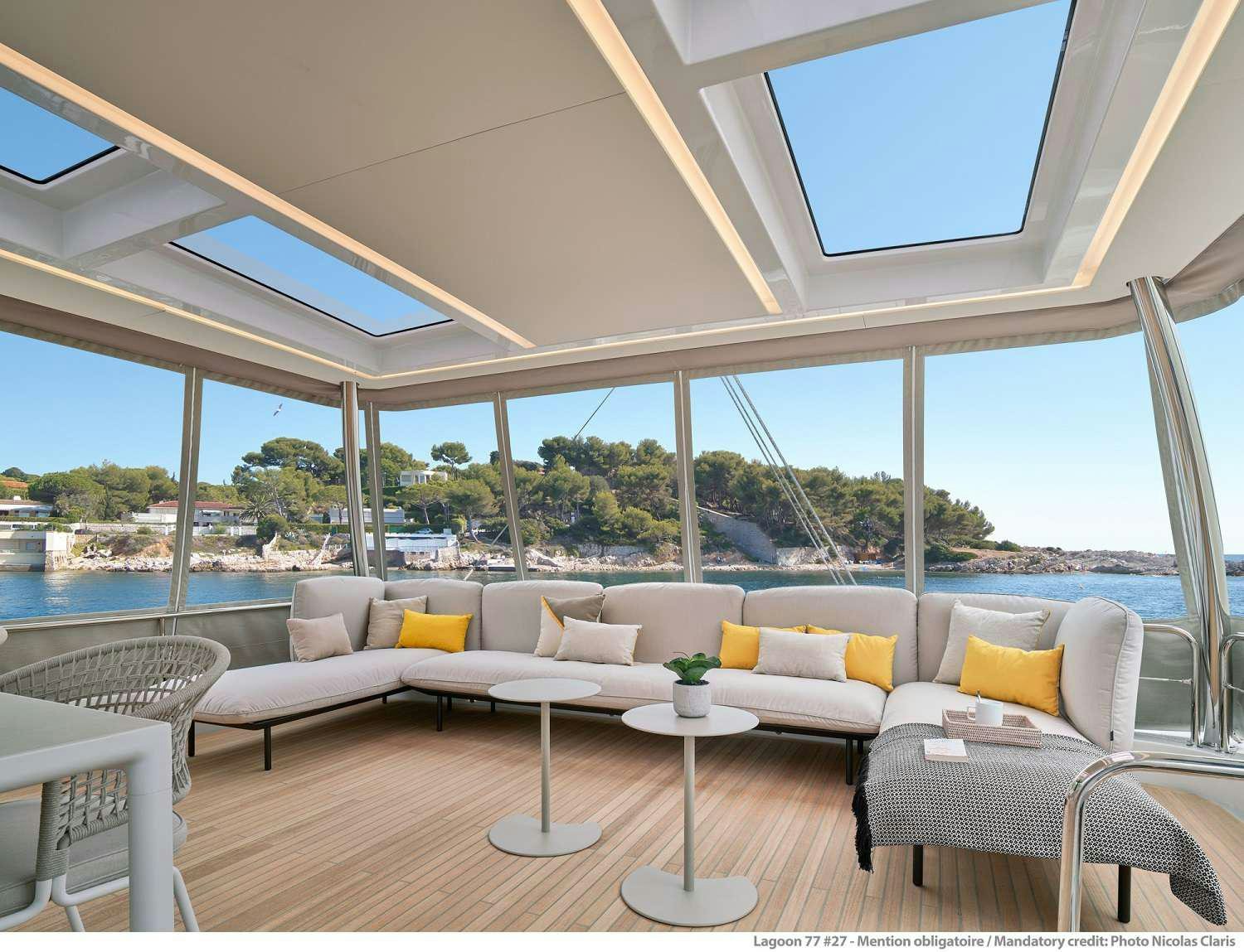 a living room with a large window aboard SYLENE Yacht for Charter