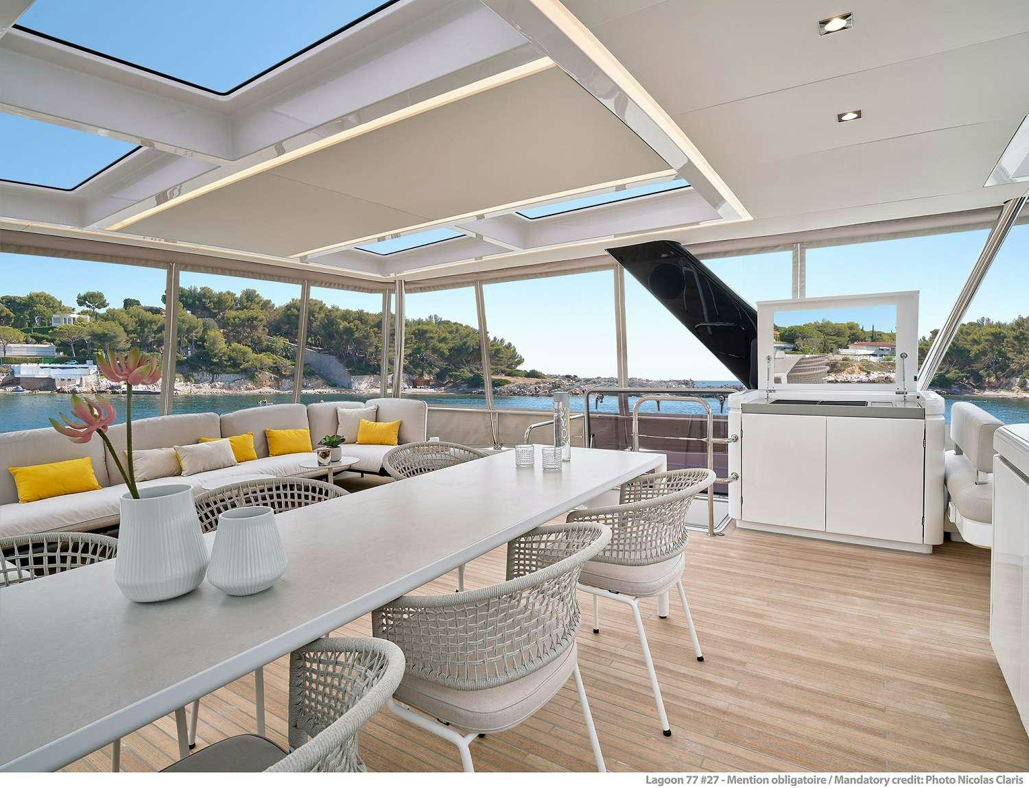 a room with a table and chairs aboard SYLENE Yacht for Charter