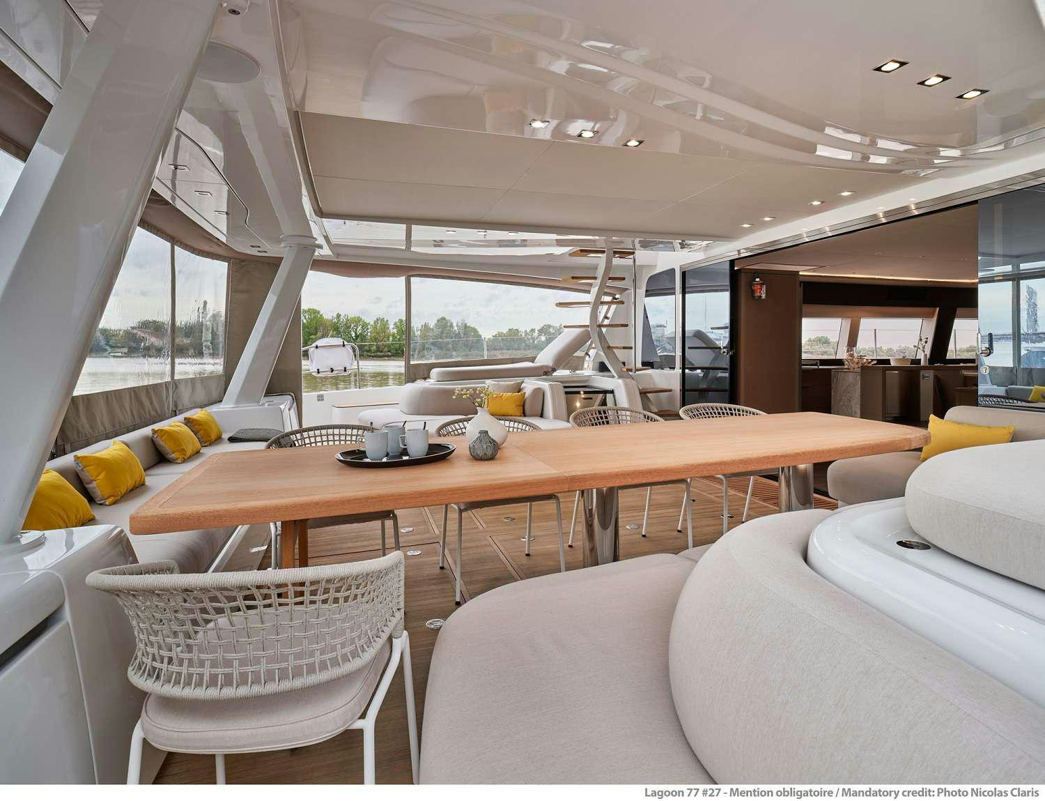 a room with a table and chairs aboard SYLENE Yacht for Charter