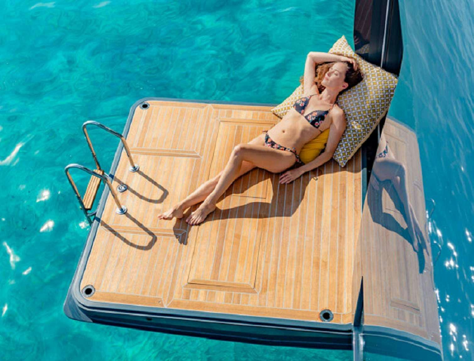 a person lying on a boat aboard SYLENE Yacht for Charter