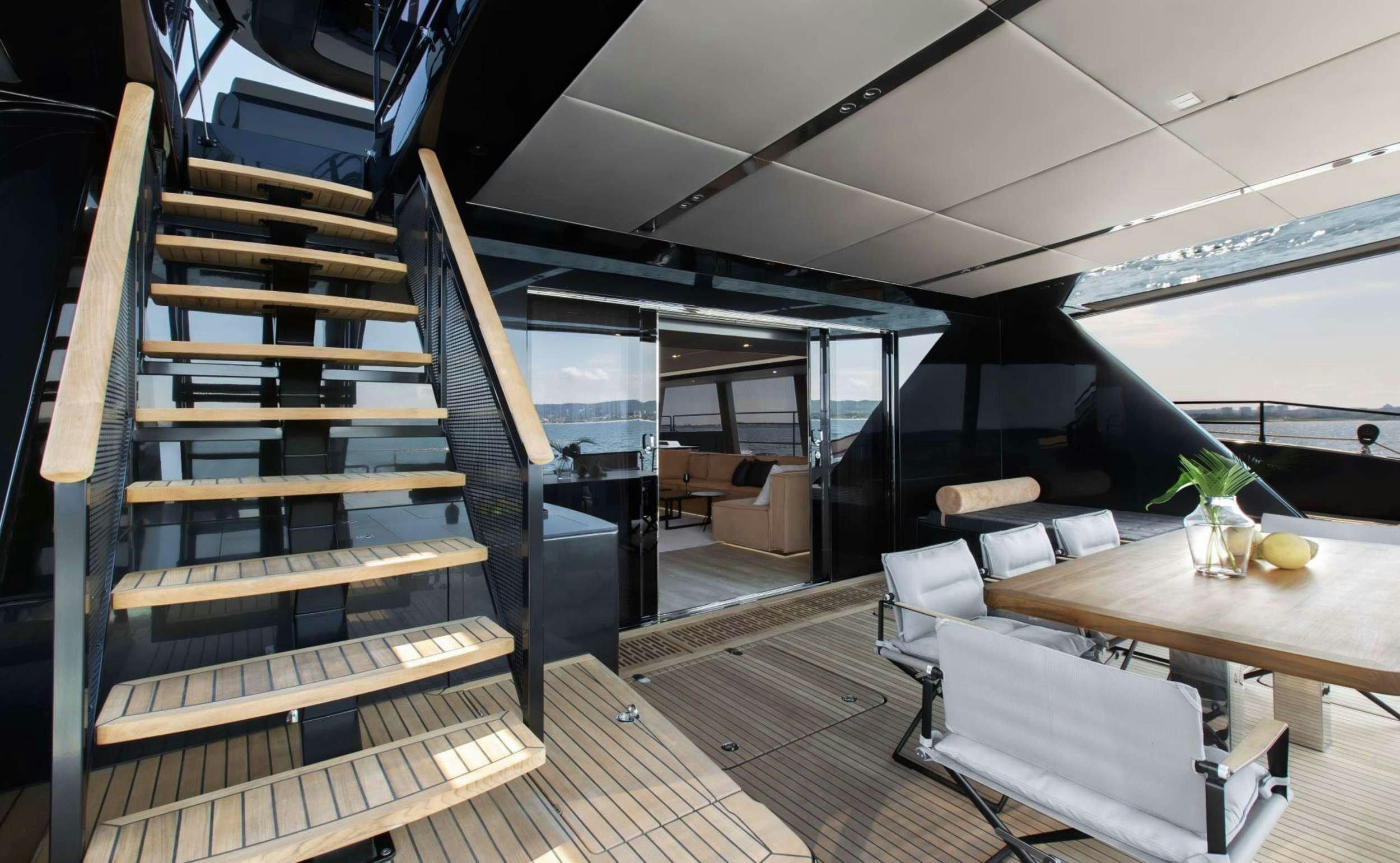 a room with a wood staircase aboard GRAYONE Yacht for Charter
