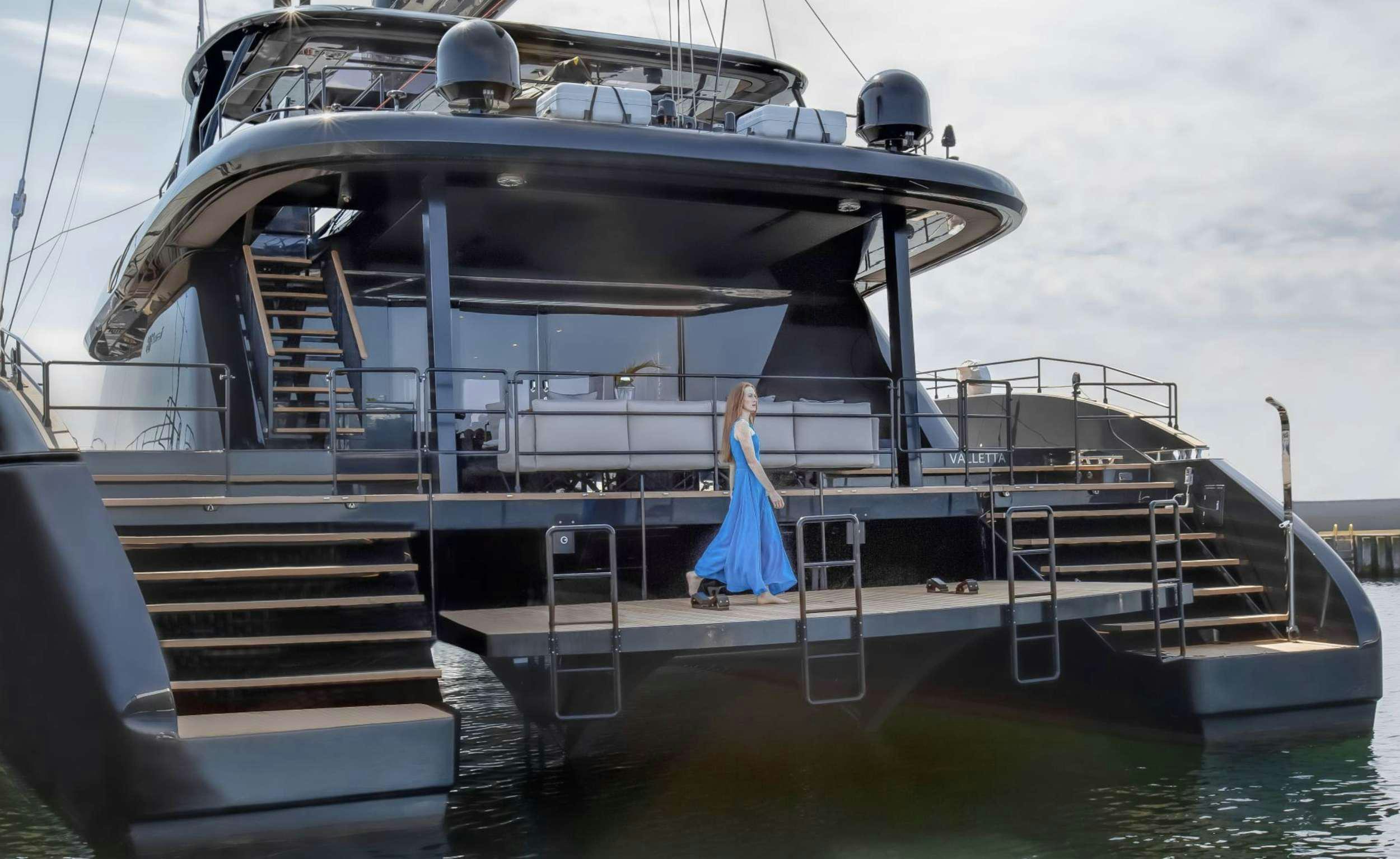 a person standing on a boat aboard GRAYONE Yacht for Charter