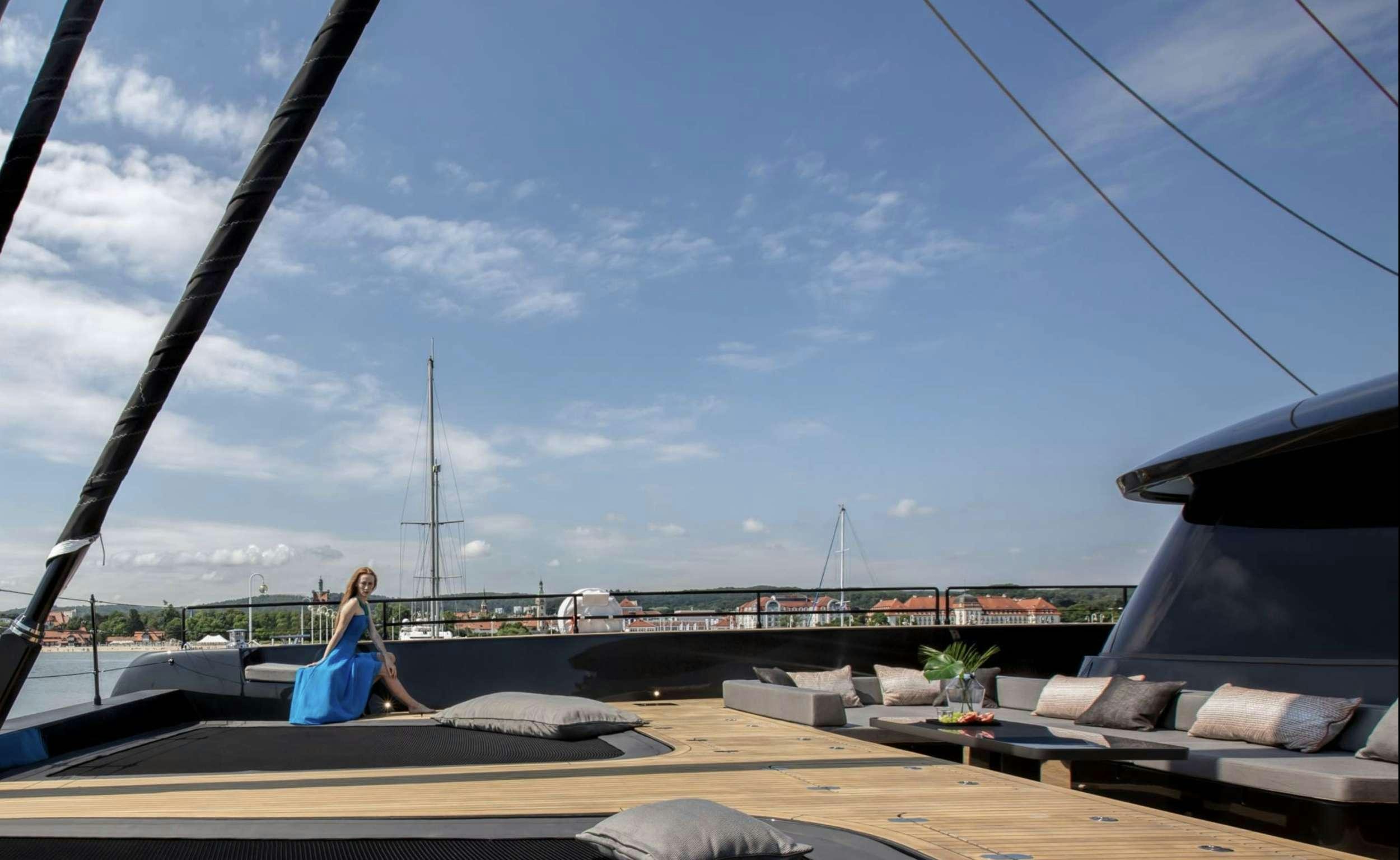 a person sitting on a roof aboard GRAYONE Yacht for Charter