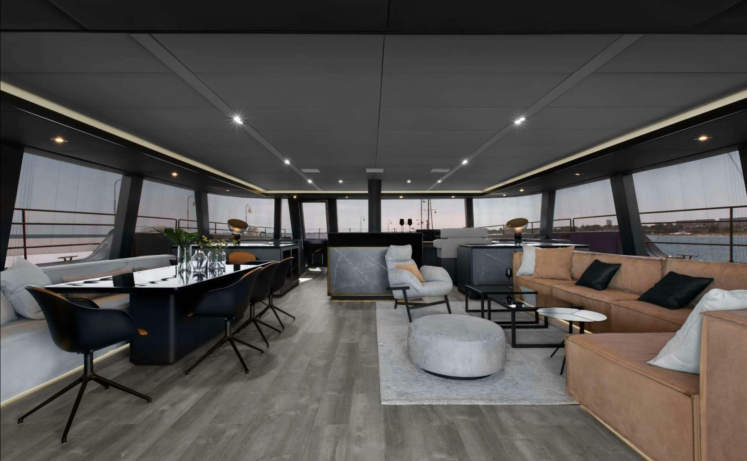 a room with a table and chairs aboard GRAYONE Yacht for Charter