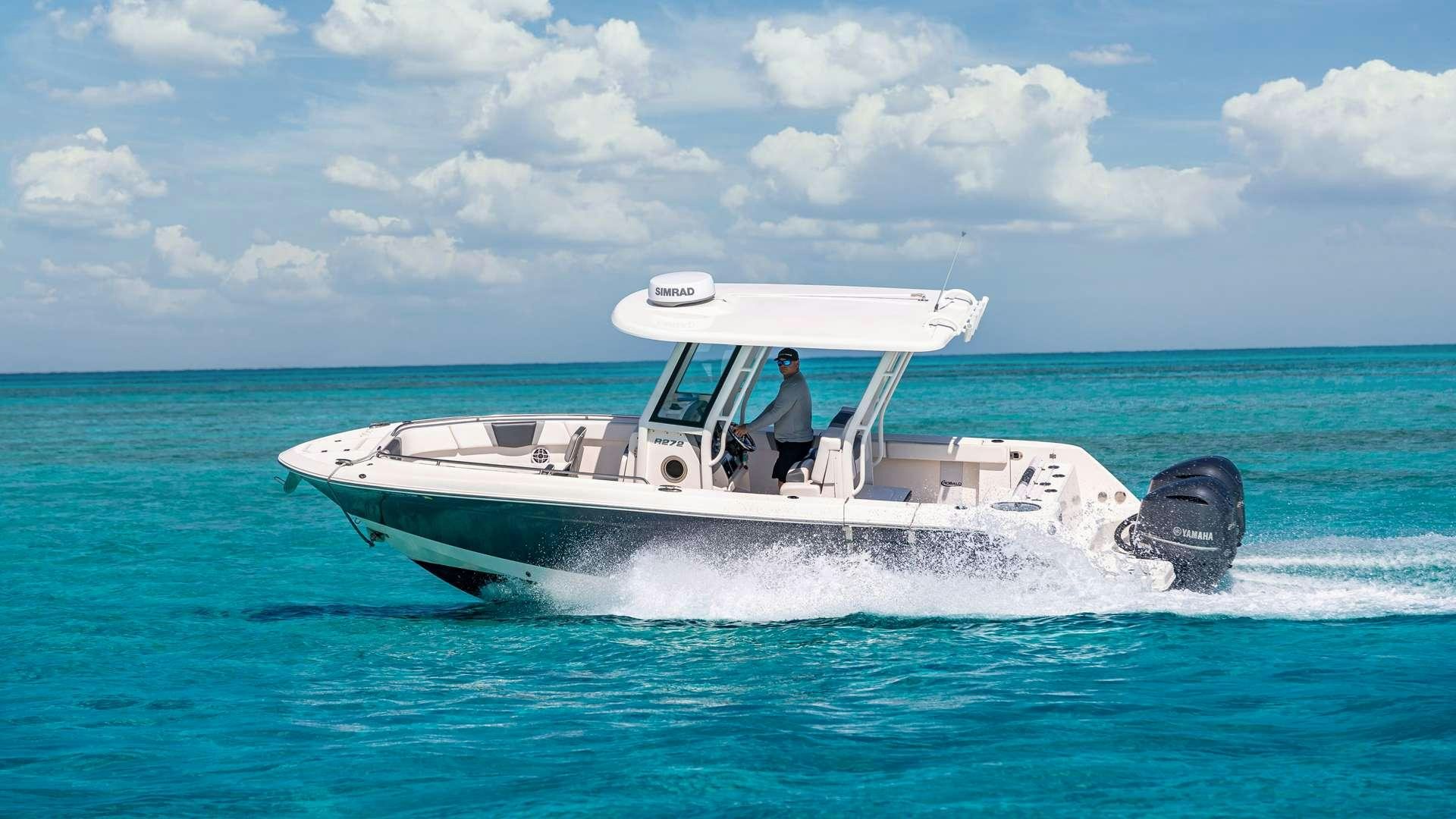 a person driving a boat aboard WHITE PEARL Yacht for Charter