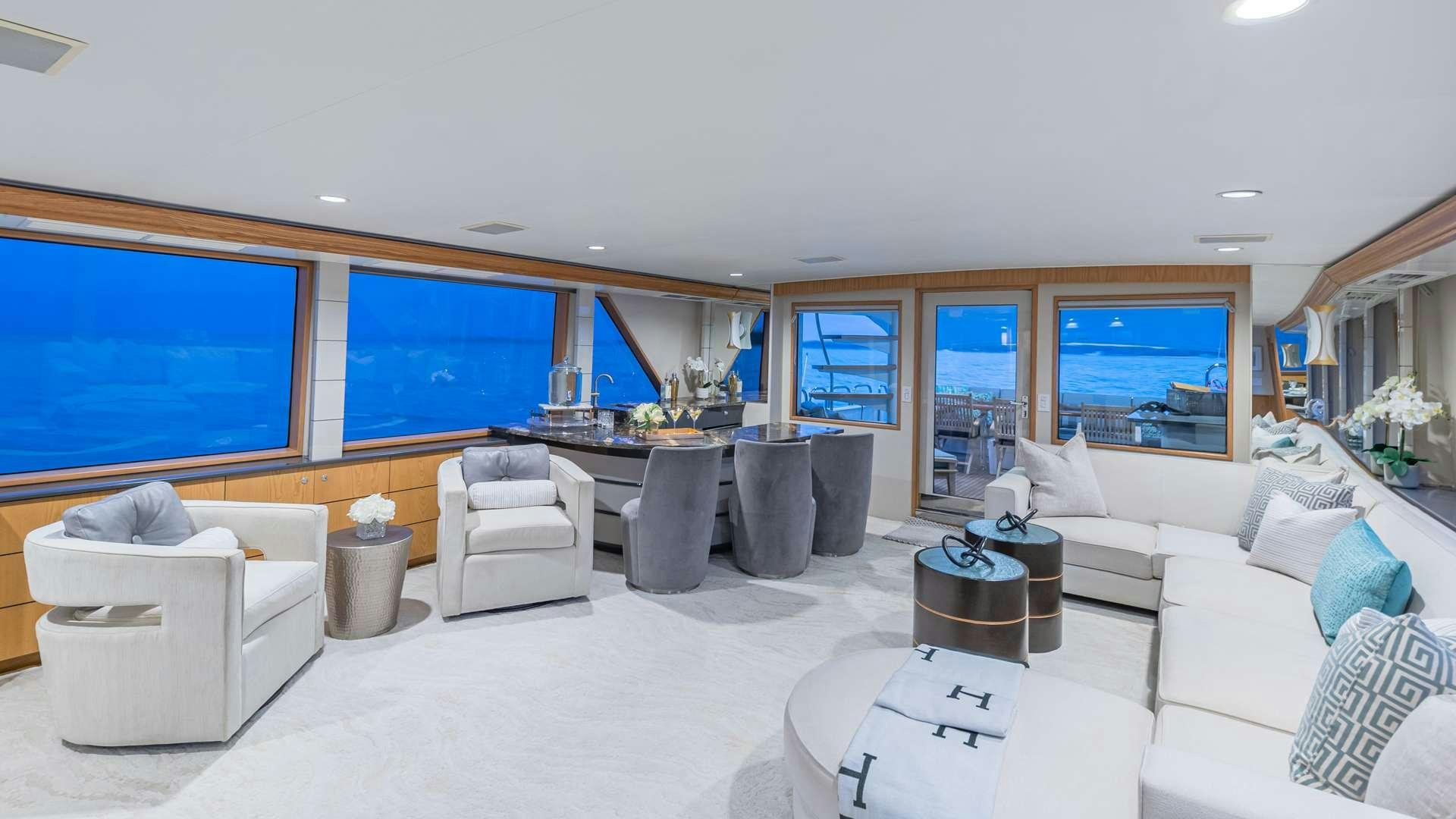 a living room with a large window aboard WHITE PEARL Yacht for Charter