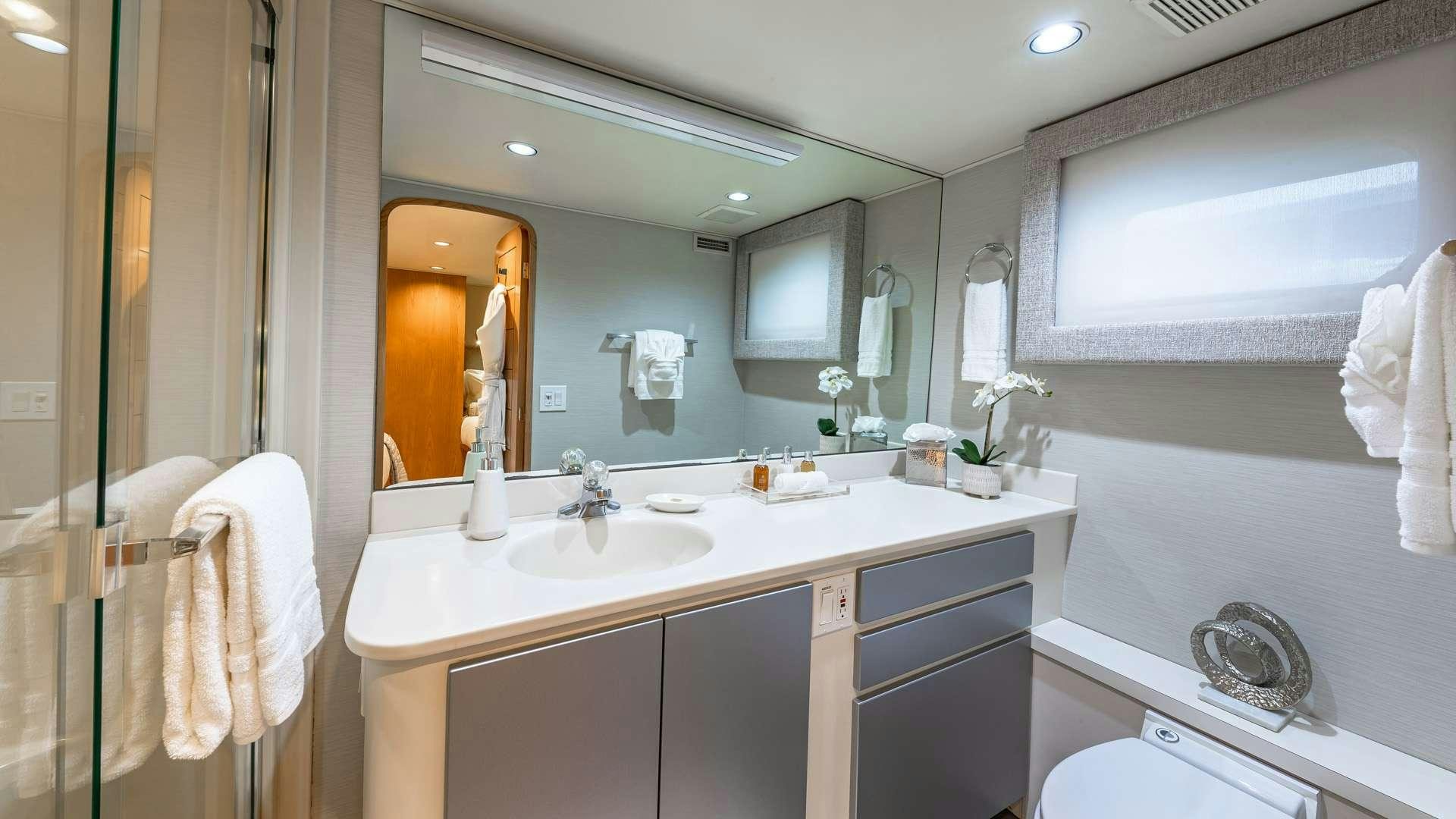 a bathroom with a large mirror aboard WHITE PEARL Yacht for Charter