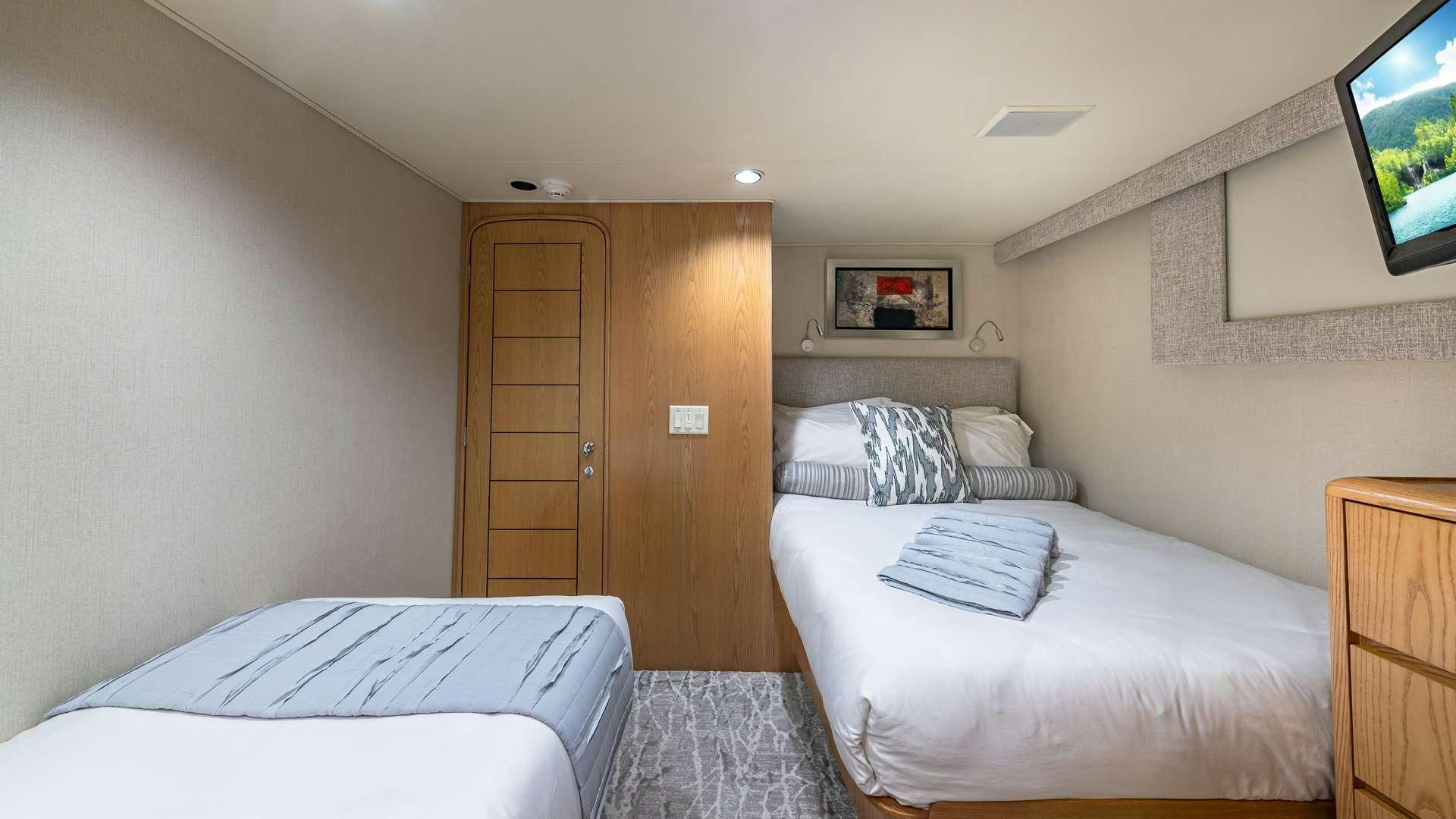 a room with two beds aboard WHITE PEARL Yacht for Charter