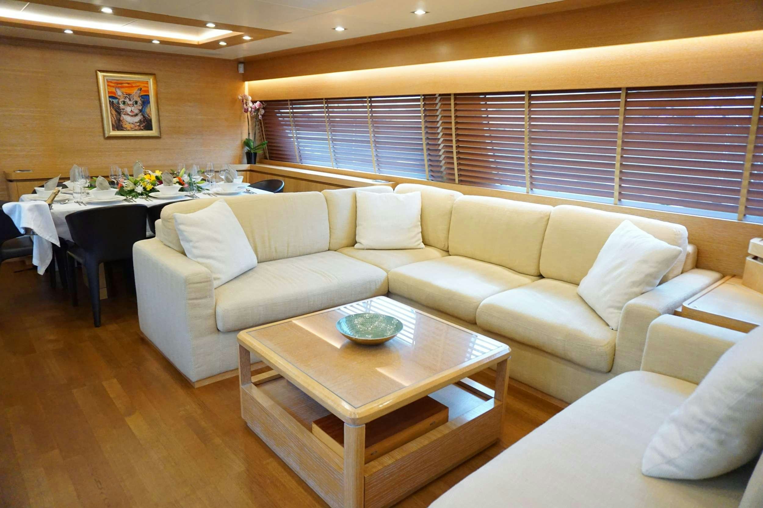 a living room with a couch and a table aboard MYTHOS Yacht for Charter