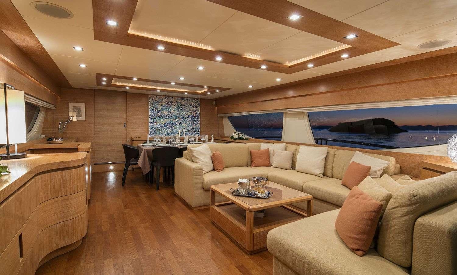 a living room with a couch and a table aboard MYTHOS Yacht for Charter