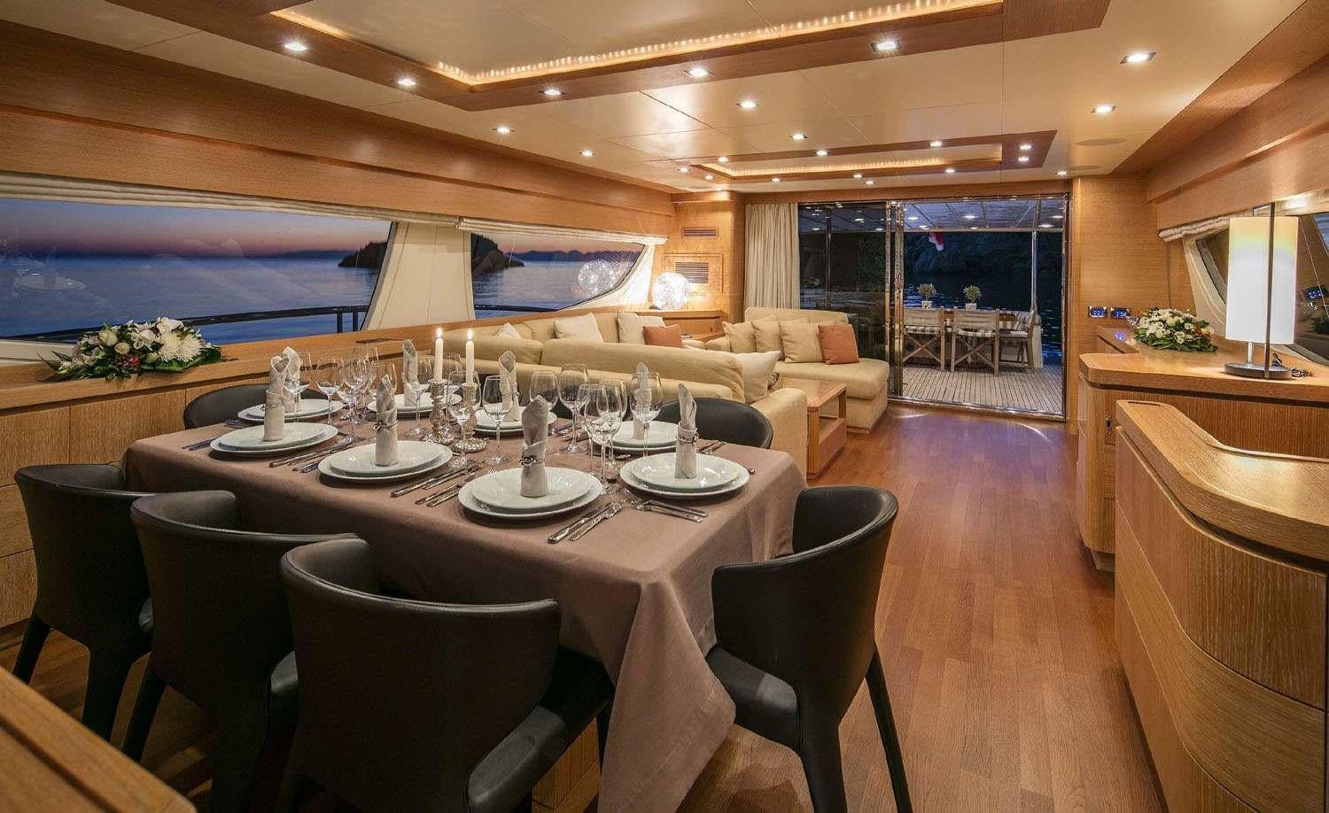 a dining room with a large table aboard MYTHOS Yacht for Charter