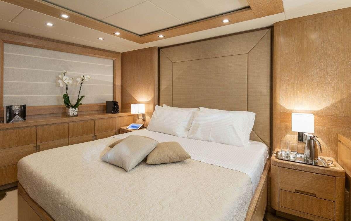 a large bed in a hotel room aboard MYTHOS Yacht for Charter