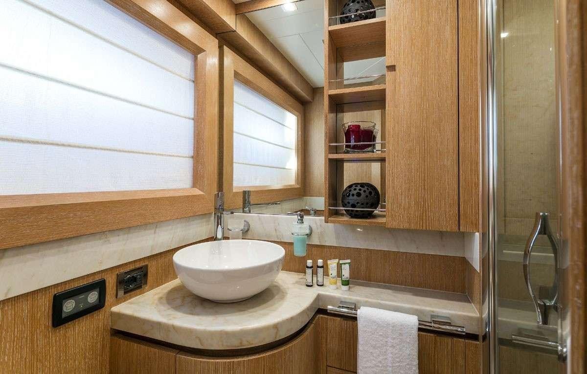 a bathroom with a sink and a mirror aboard MYTHOS Yacht for Charter