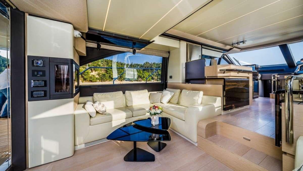 a living room with a couch and a table aboard KARAT II Yacht for Charter