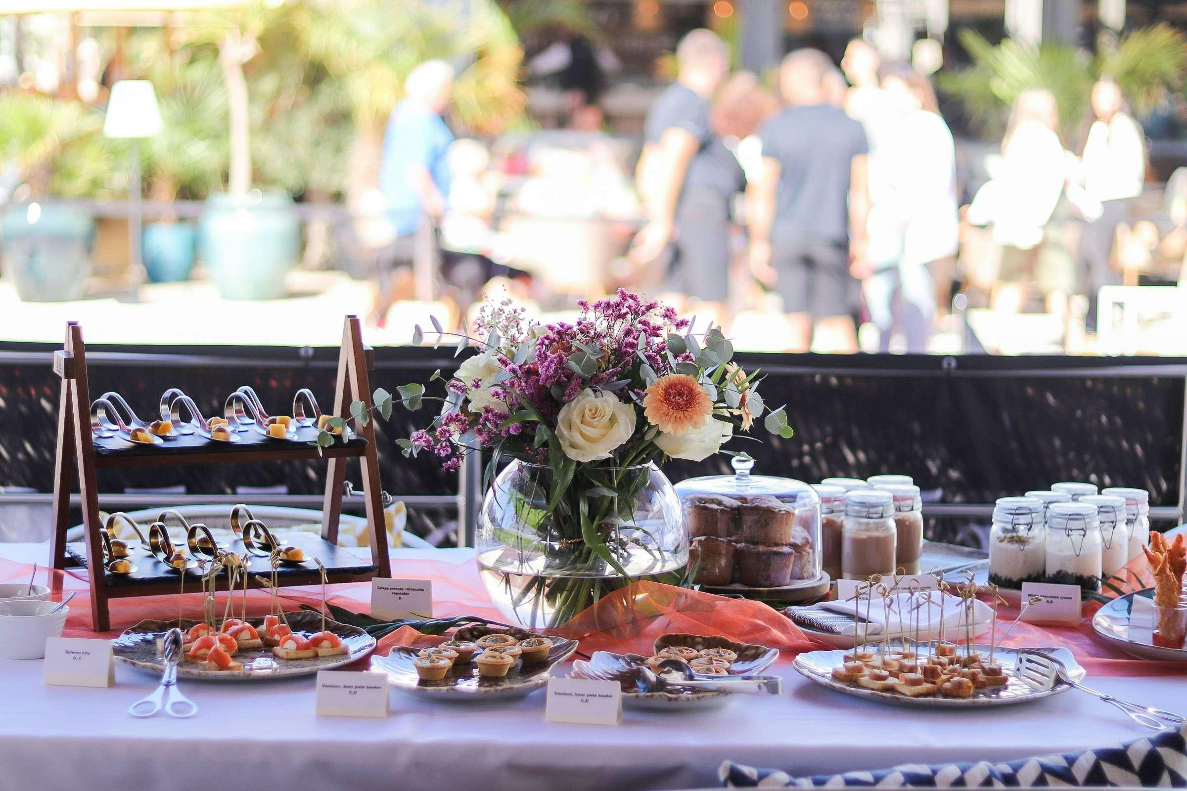 a table with food and flowers aboard ANETTA Yacht for Charter