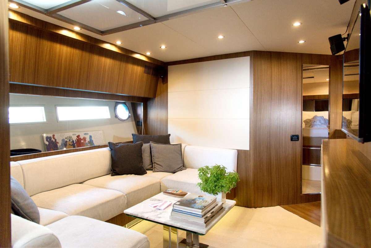 a living room with a couch and a coffee table aboard W Yacht for Charter