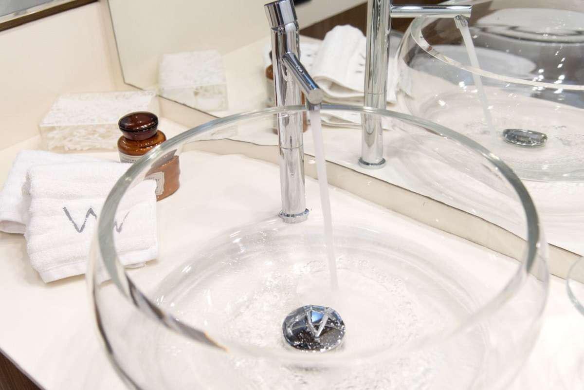a sink with a faucet aboard W Yacht for Charter
