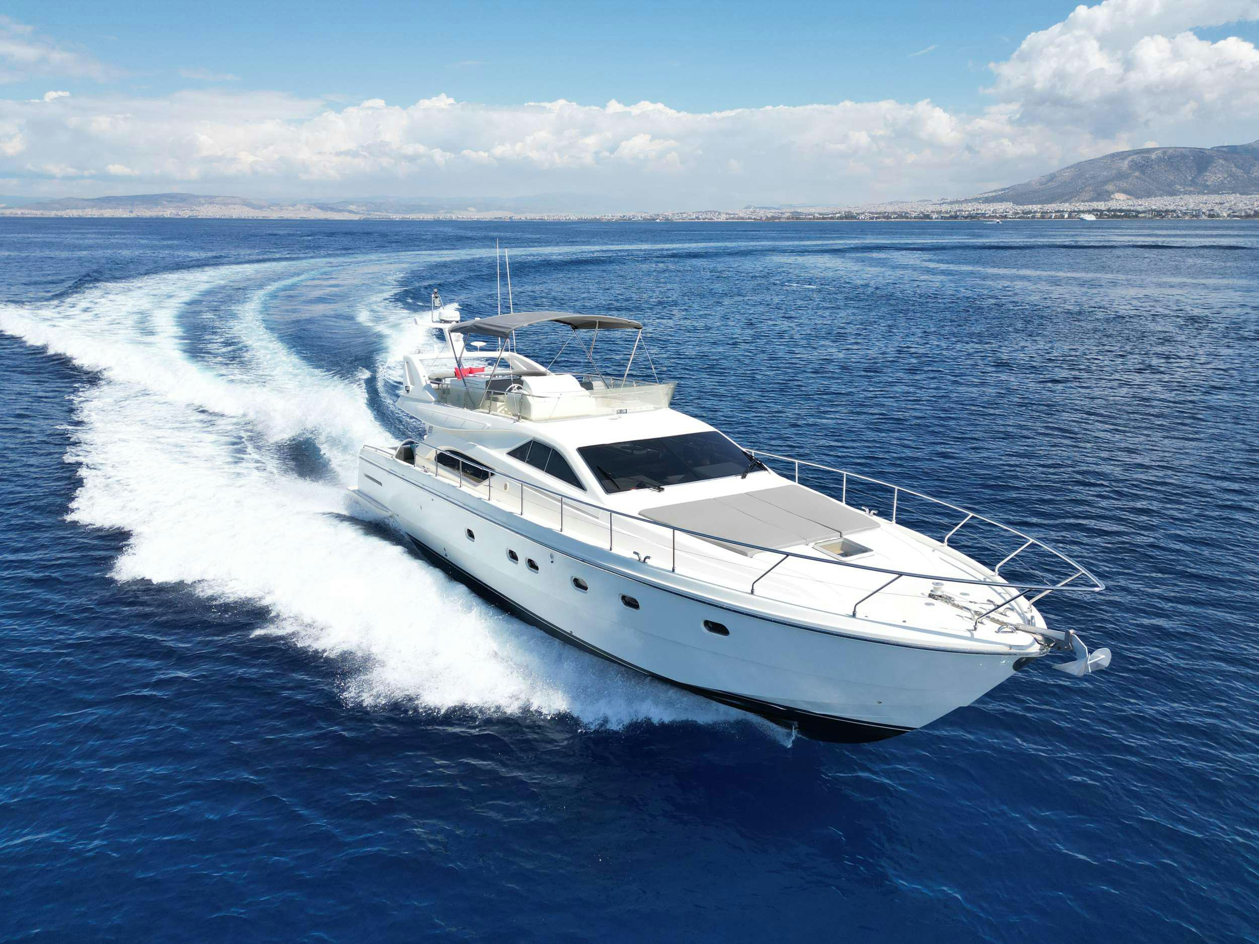 a white yacht on the water aboard SUMMER CAMP Yacht for Charter