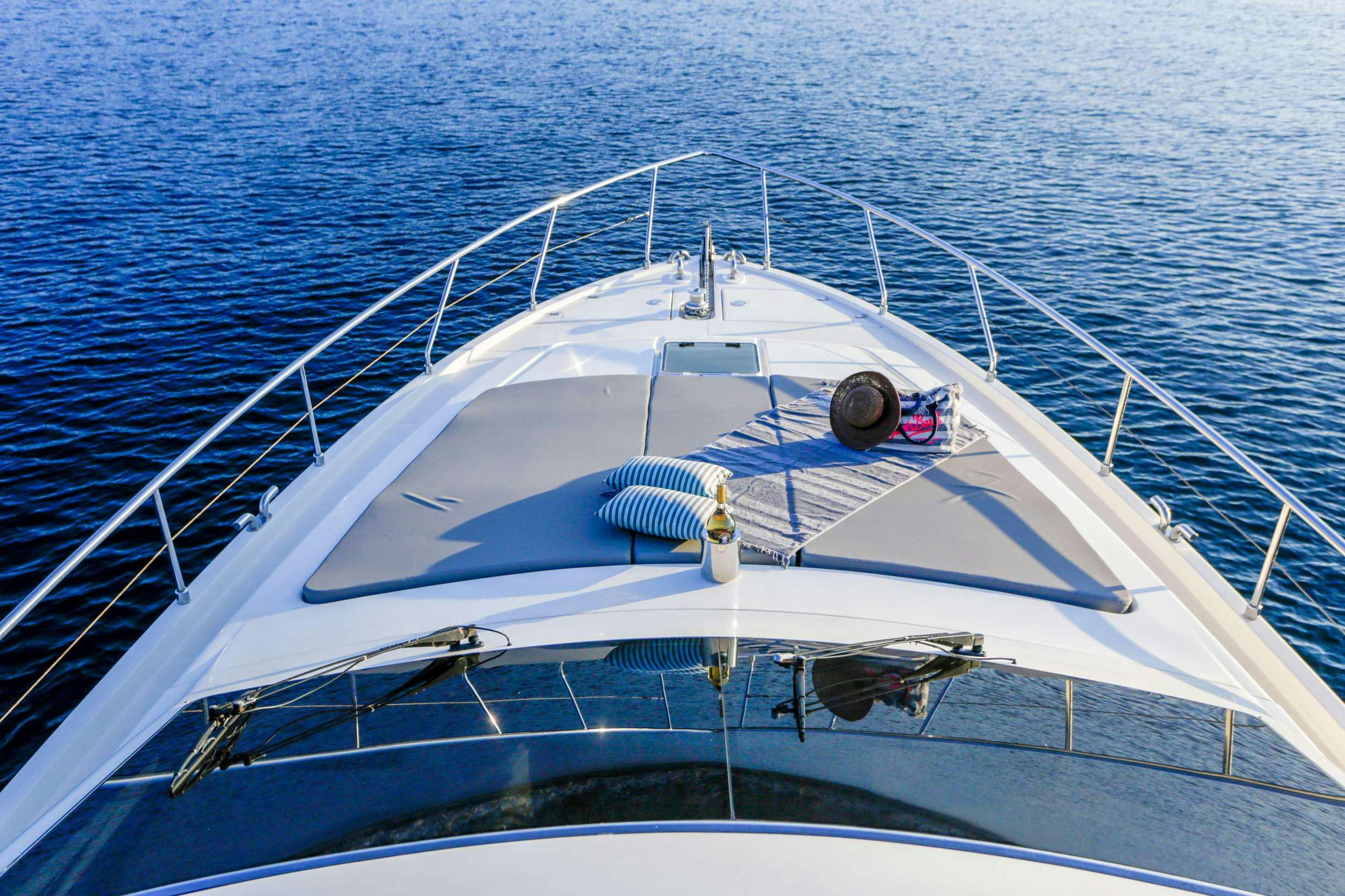 a white boat in the water aboard SUMMER CAMP Yacht for Charter