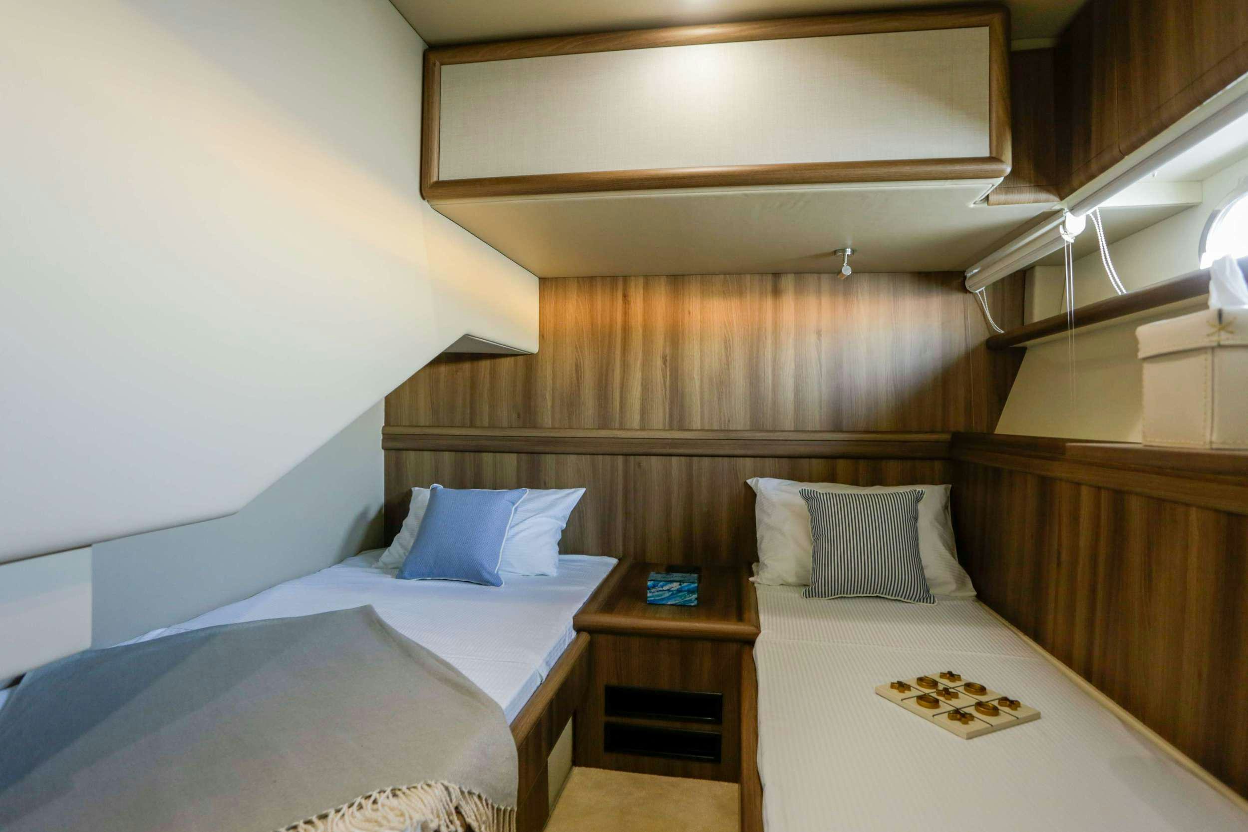 a room with two beds aboard SUMMER CAMP Yacht for Charter