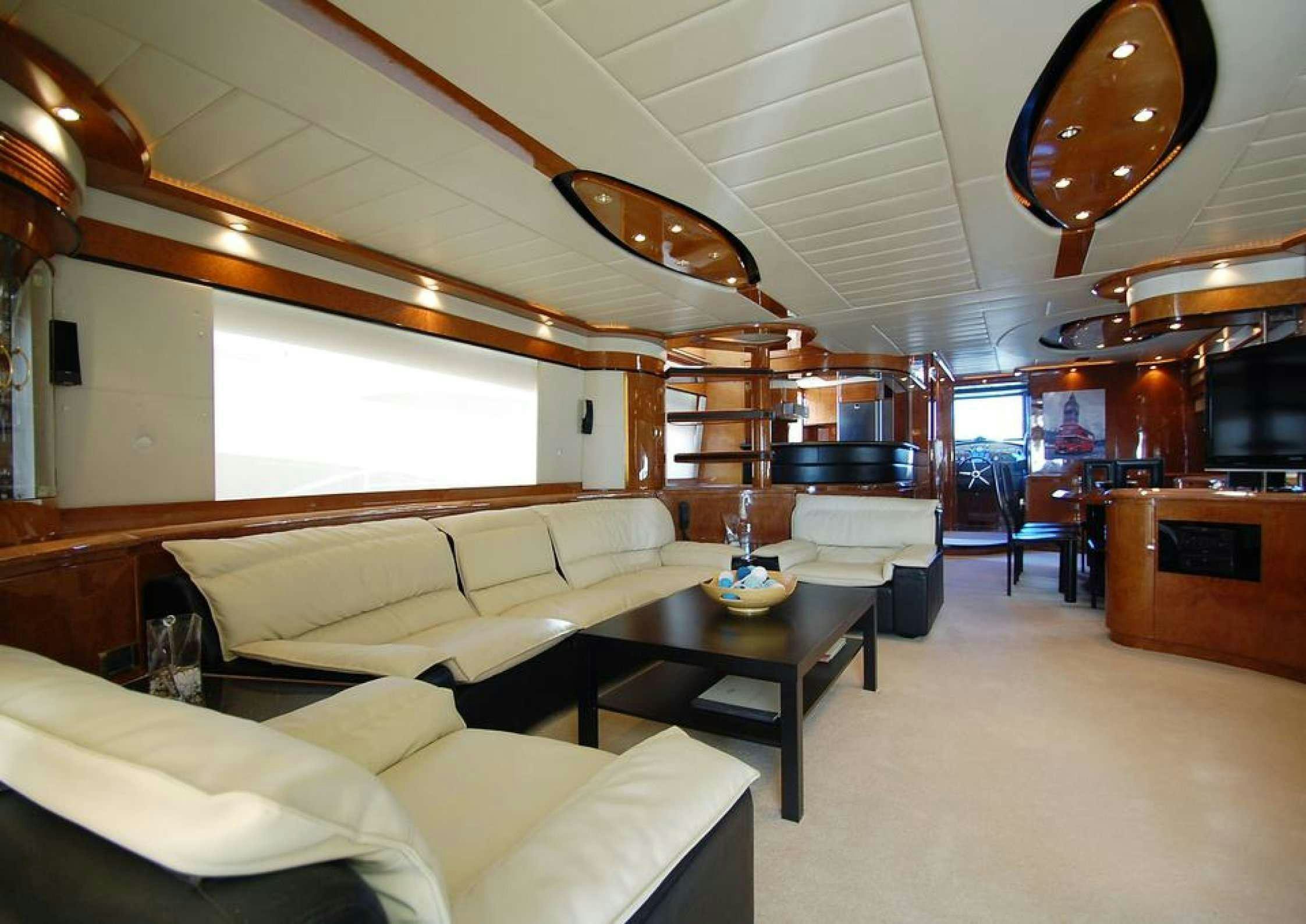 a living room with a couch and a table aboard LEIGH Yacht for Charter