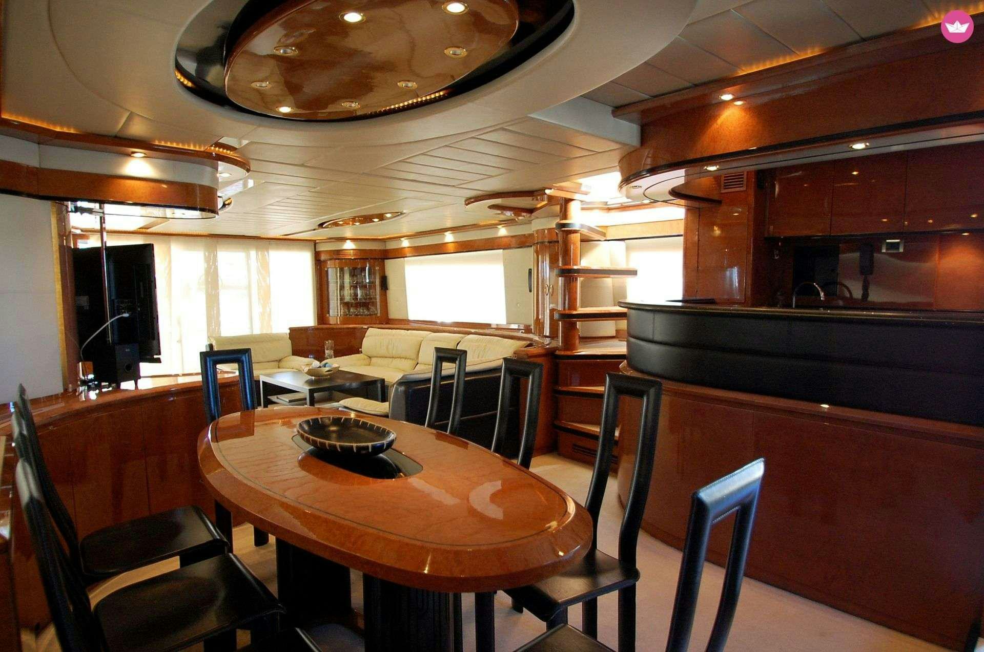 a dining room with a table and chairs aboard LEIGH Yacht for Charter