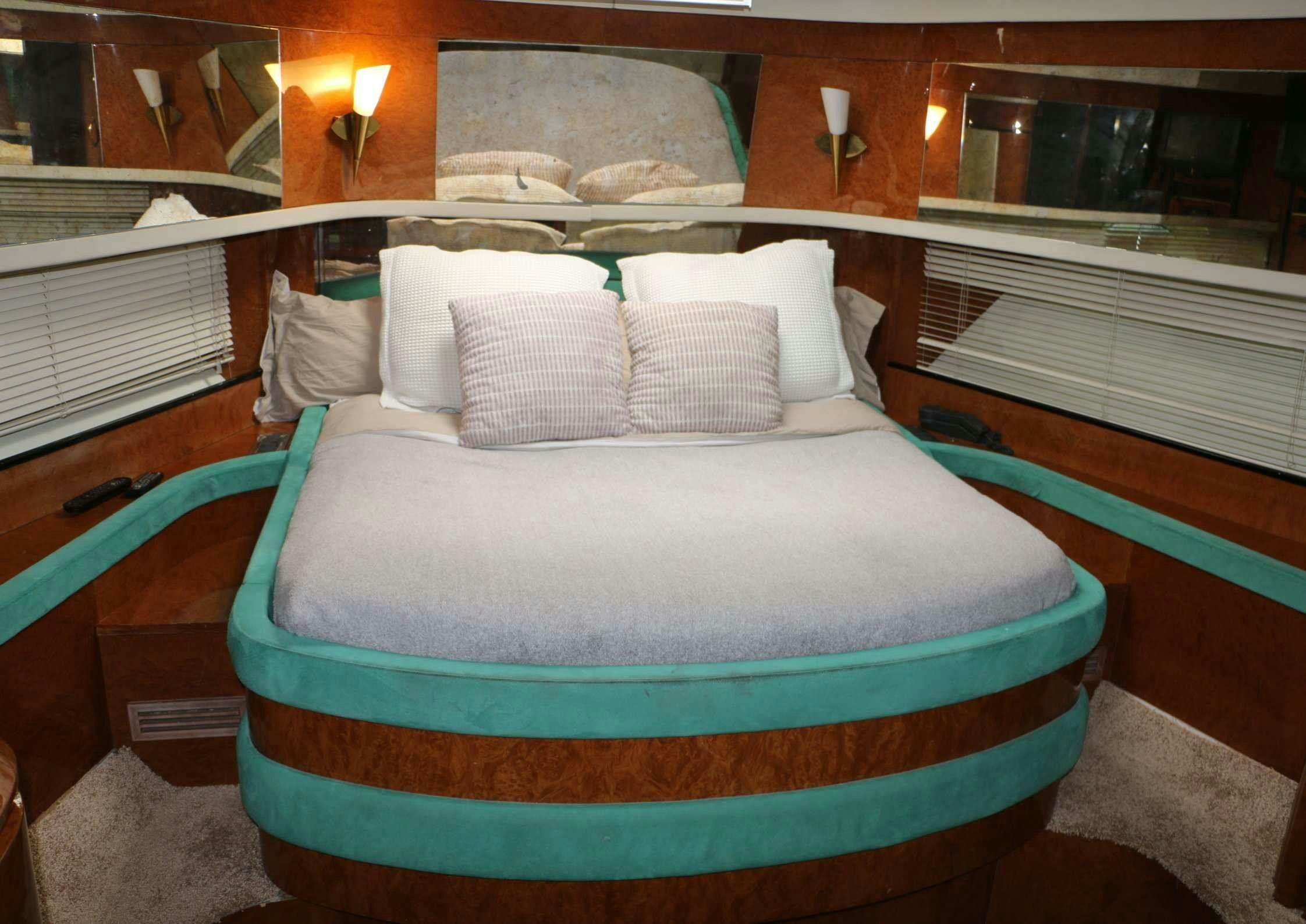 a bed in a room aboard LEIGH Yacht for Charter