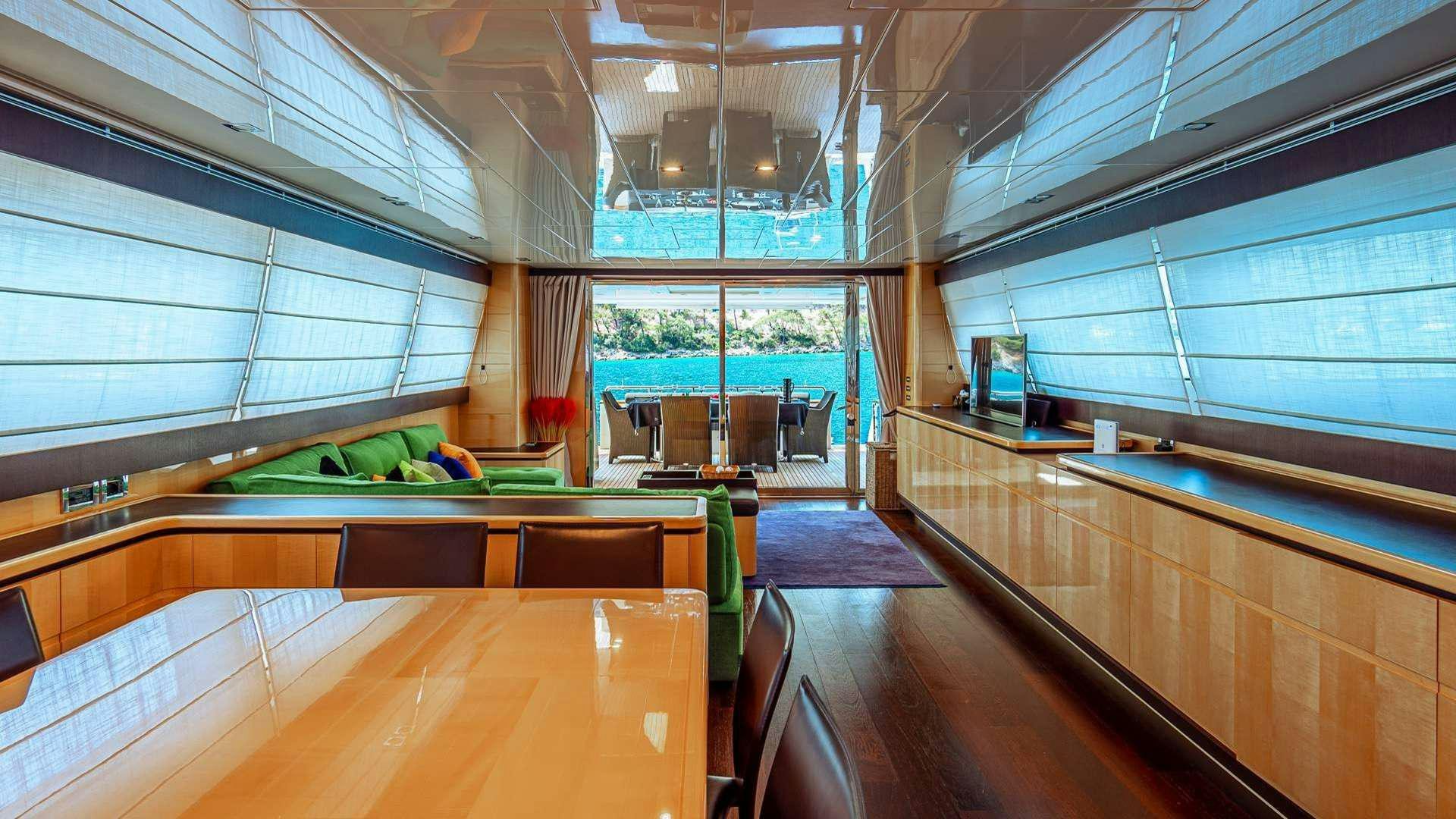 a room with a table and chairs aboard LIBERATA Yacht for Charter