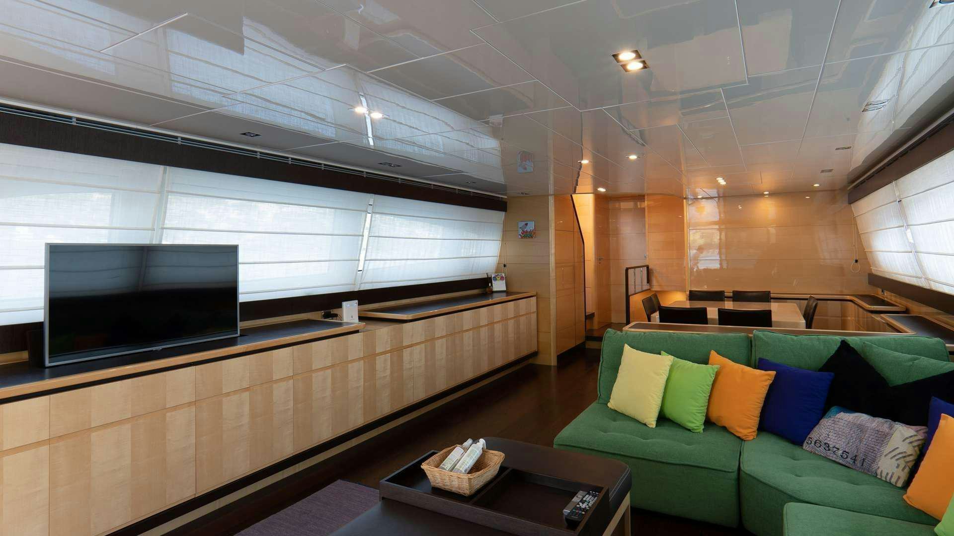 a room with couches and a tv aboard LIBERATA Yacht for Charter