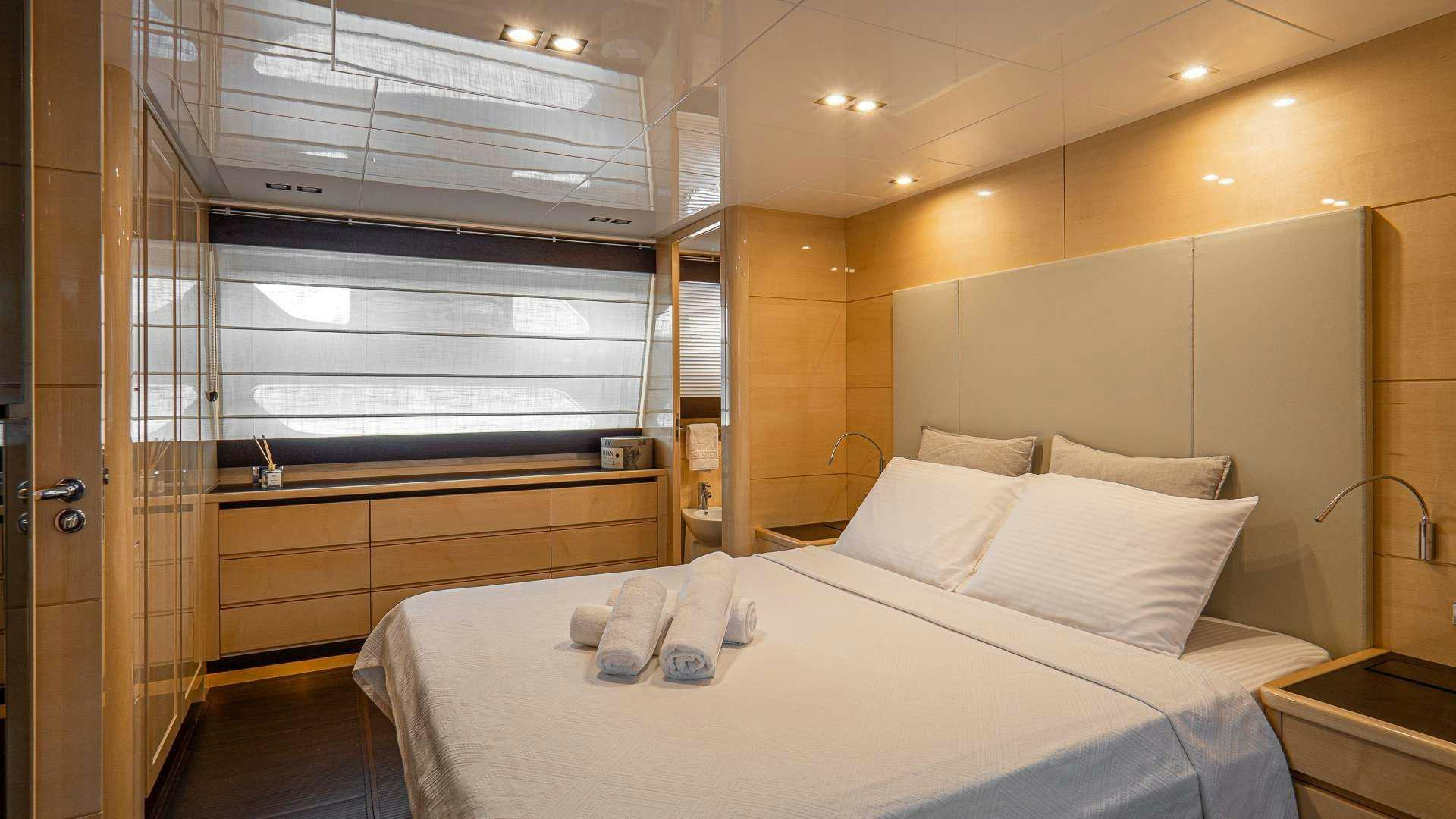 a bed in a room aboard LIBERATA Yacht for Charter