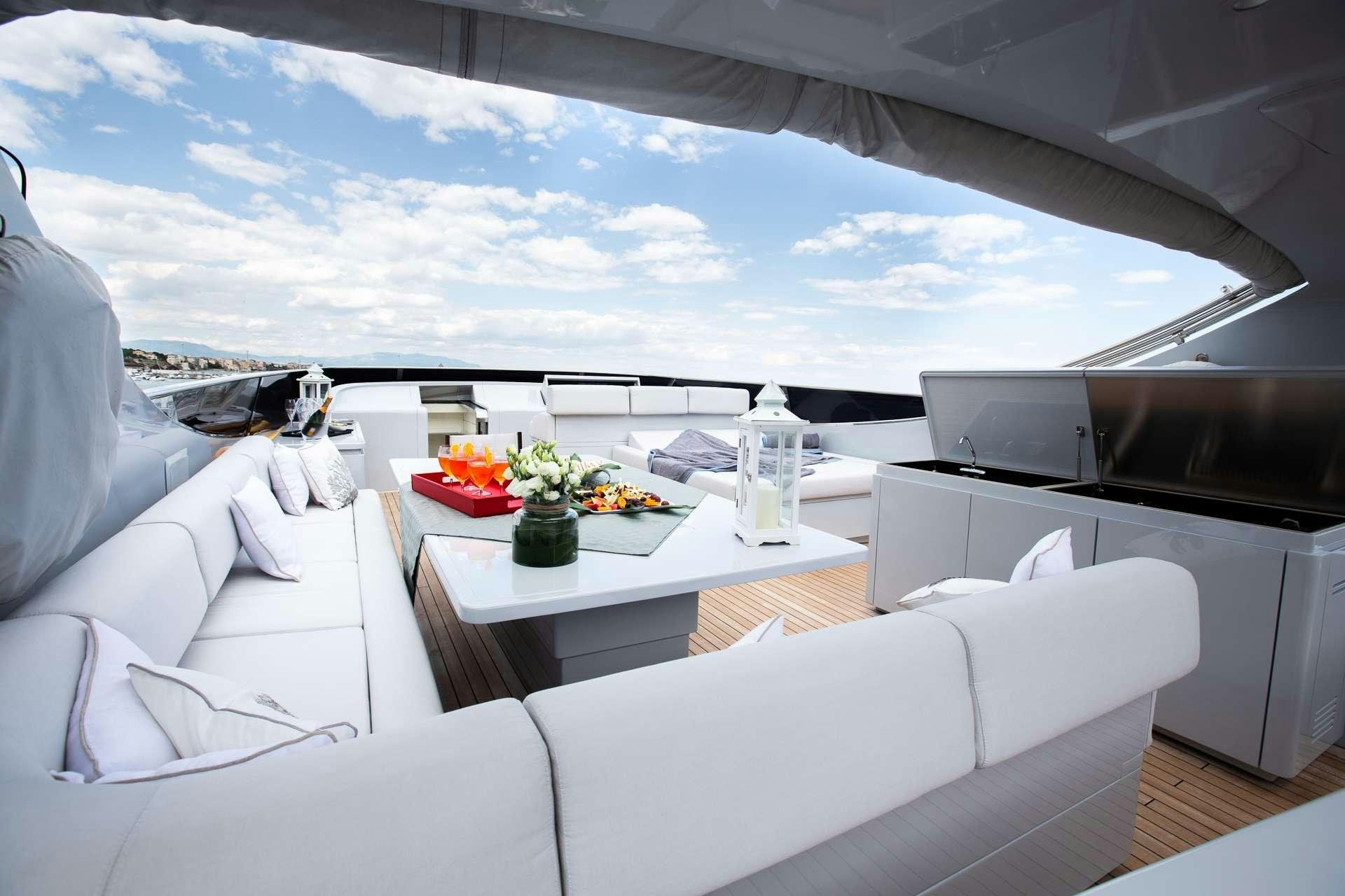 a room with a table and chairs aboard CAMILLA A Yacht for Charter