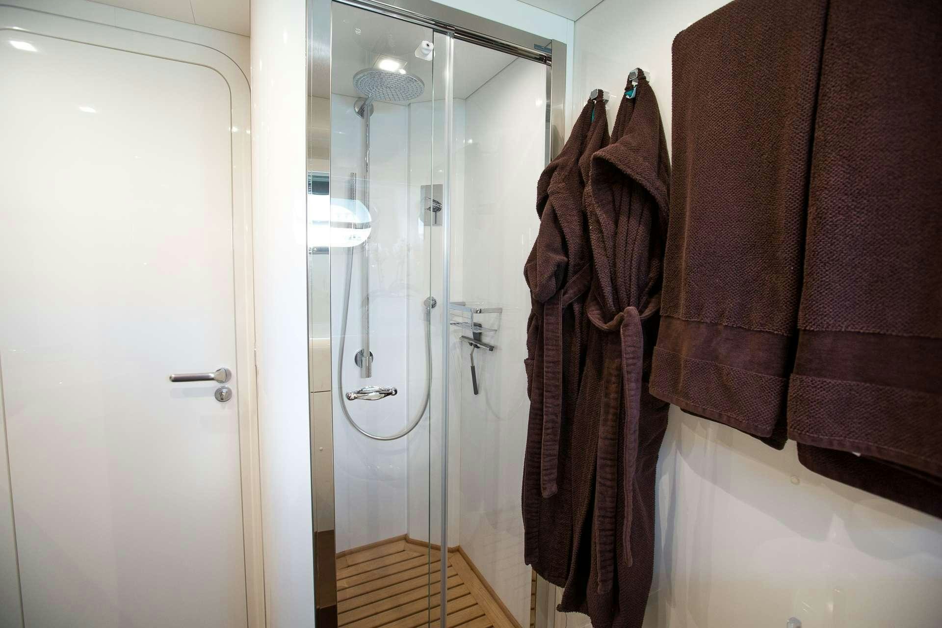 a bathroom with a towel on the wall aboard CAMILLA A Yacht for Charter