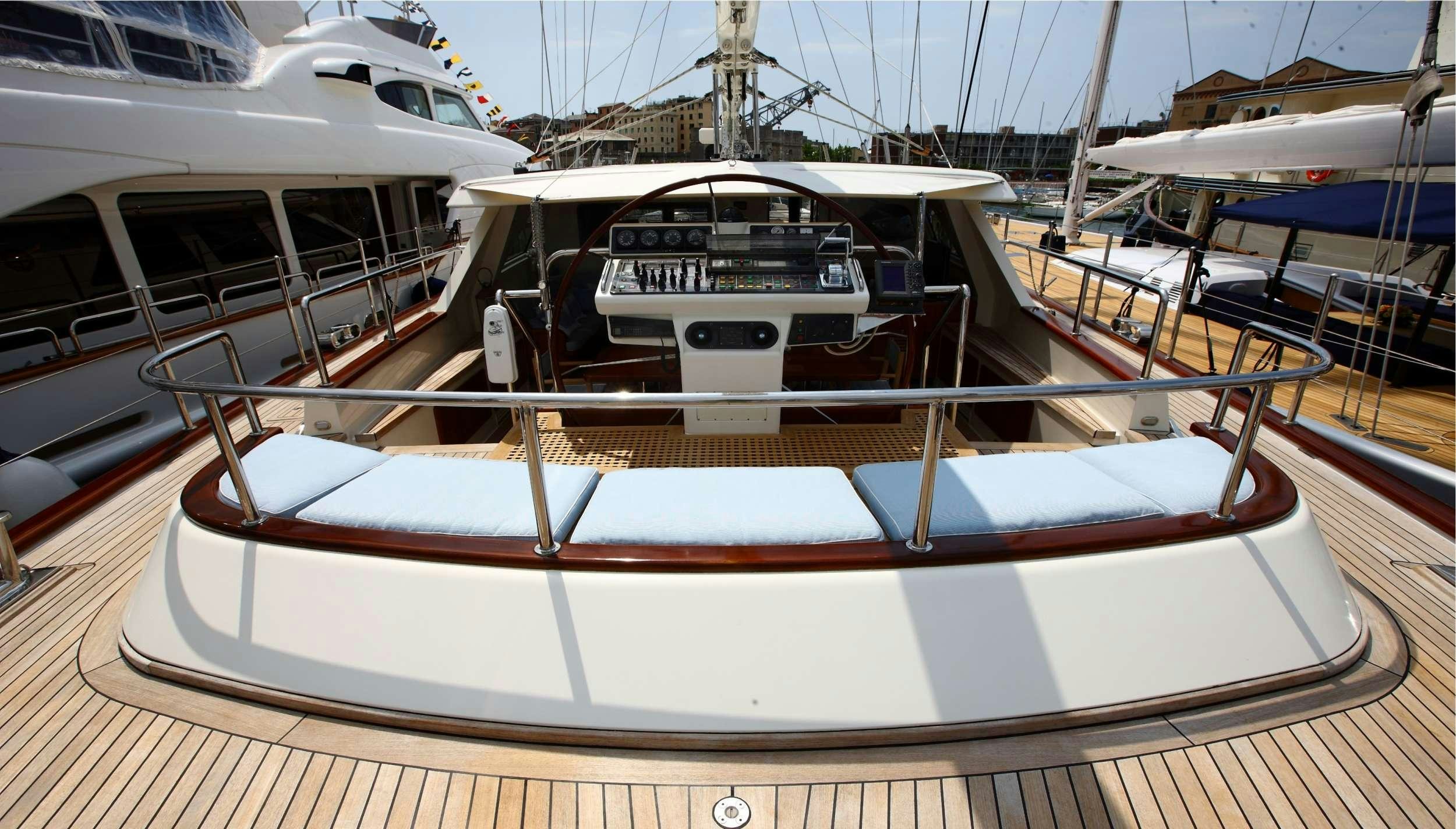 a boat in a harbor aboard HERITAGE M Yacht for Charter