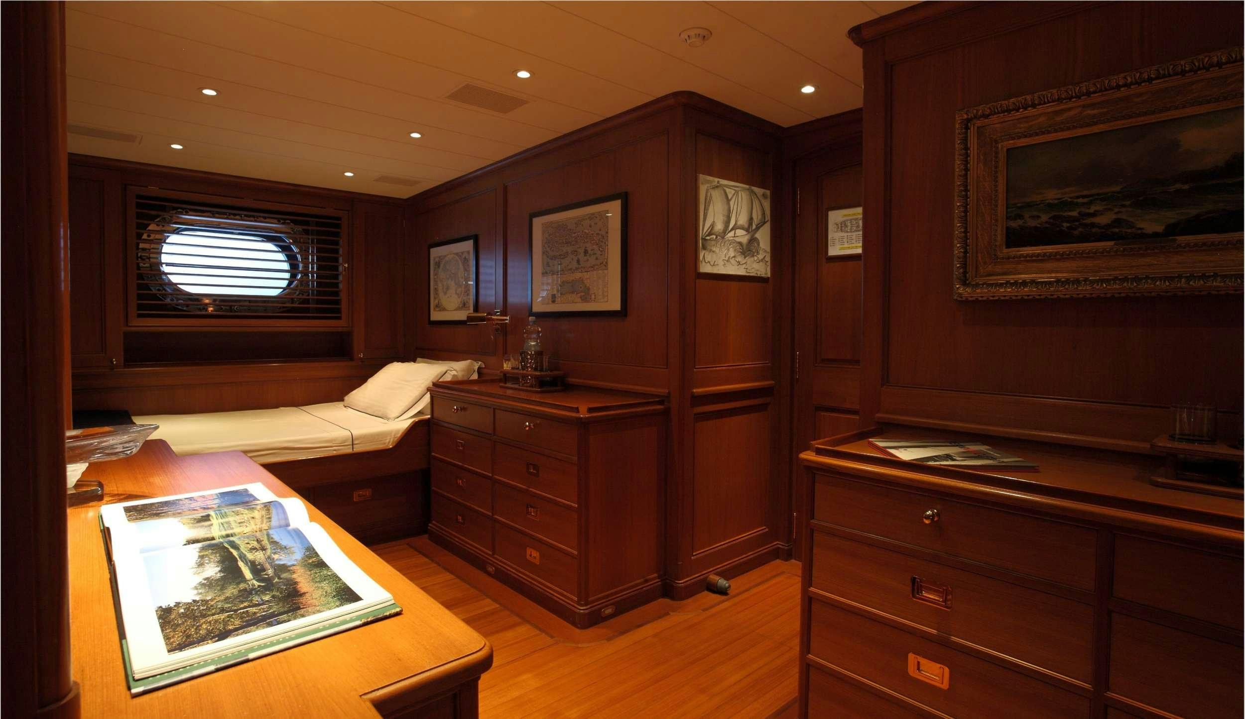 a room with a table and a couch aboard HERITAGE M Yacht for Charter