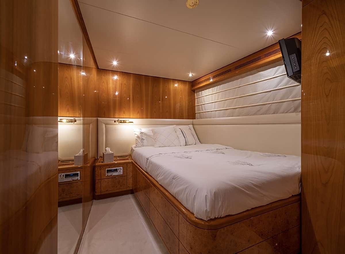 a room with a bed and a desk aboard GOLDEN EAGLE Yacht for Charter
