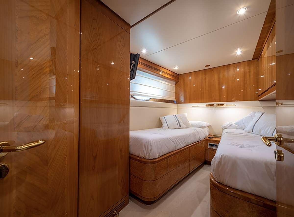 a room with a bed and a closet aboard GOLDEN EAGLE Yacht for Charter