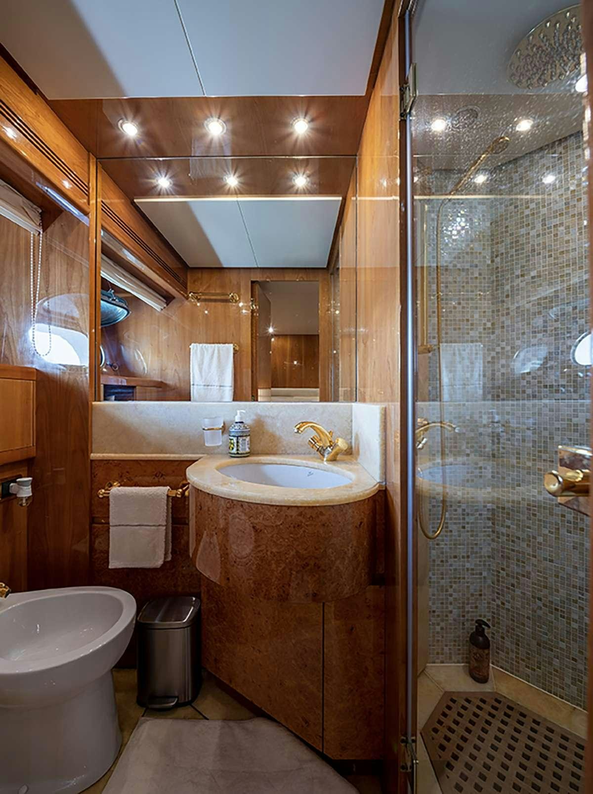 a bathroom with a glass shower aboard GOLDEN EAGLE Yacht for Charter