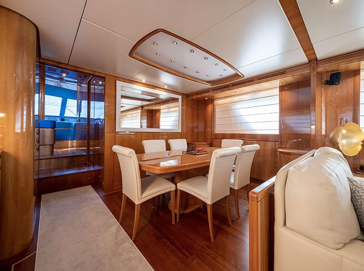 a room with a table and chairs aboard GOLDEN EAGLE Yacht for Charter