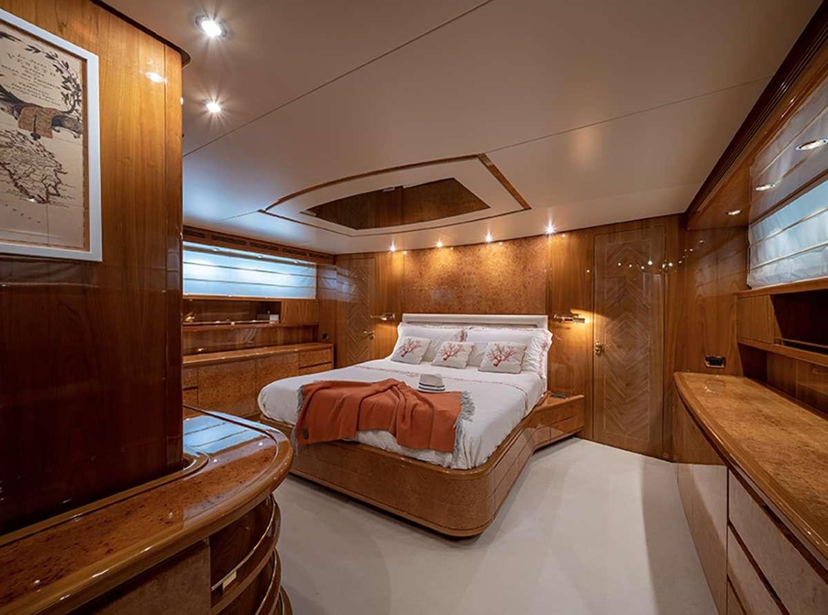 a bedroom with a bed aboard GOLDEN EAGLE Yacht for Charter