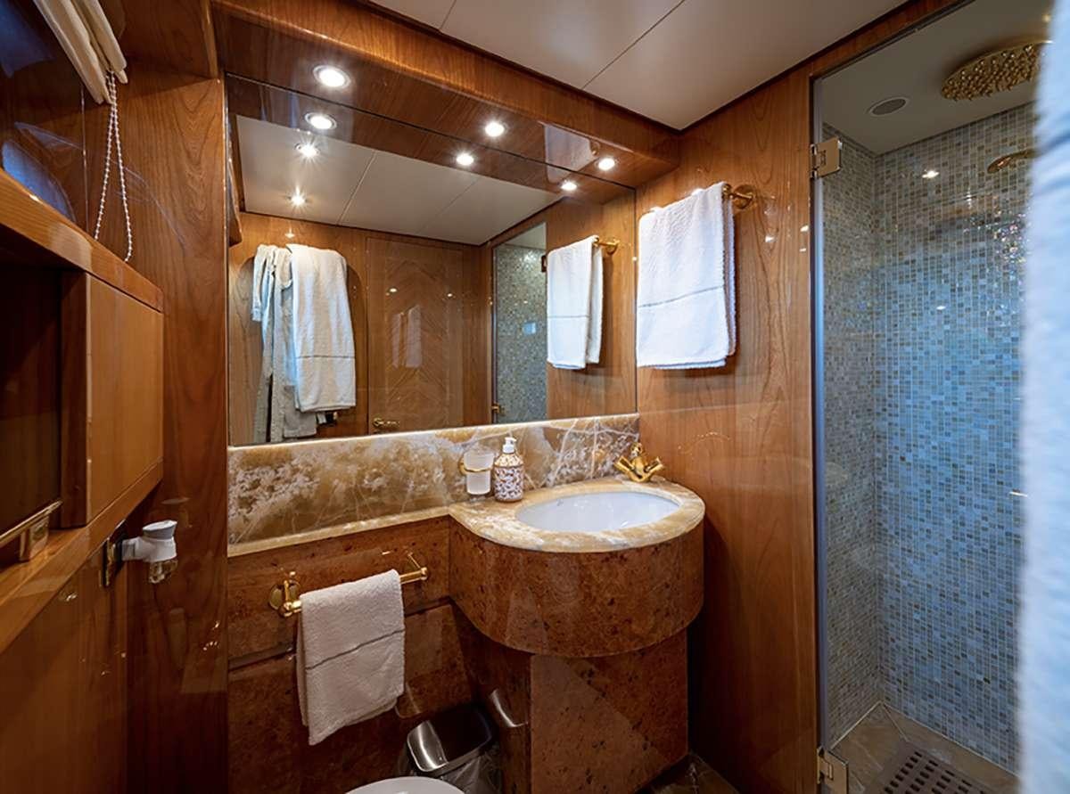 a bathroom with a sink and a mirror aboard GOLDEN EAGLE Yacht for Charter