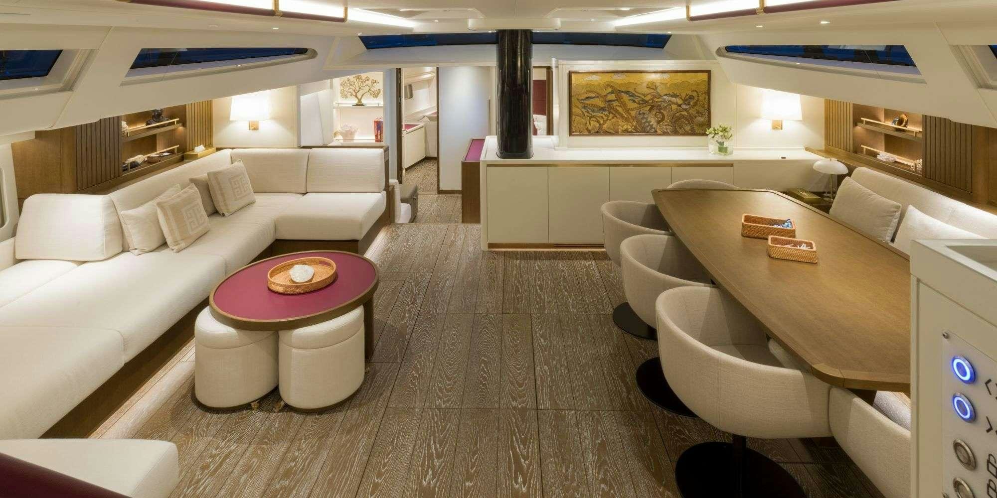a room with a couch and a table aboard FANCY Yacht for Charter